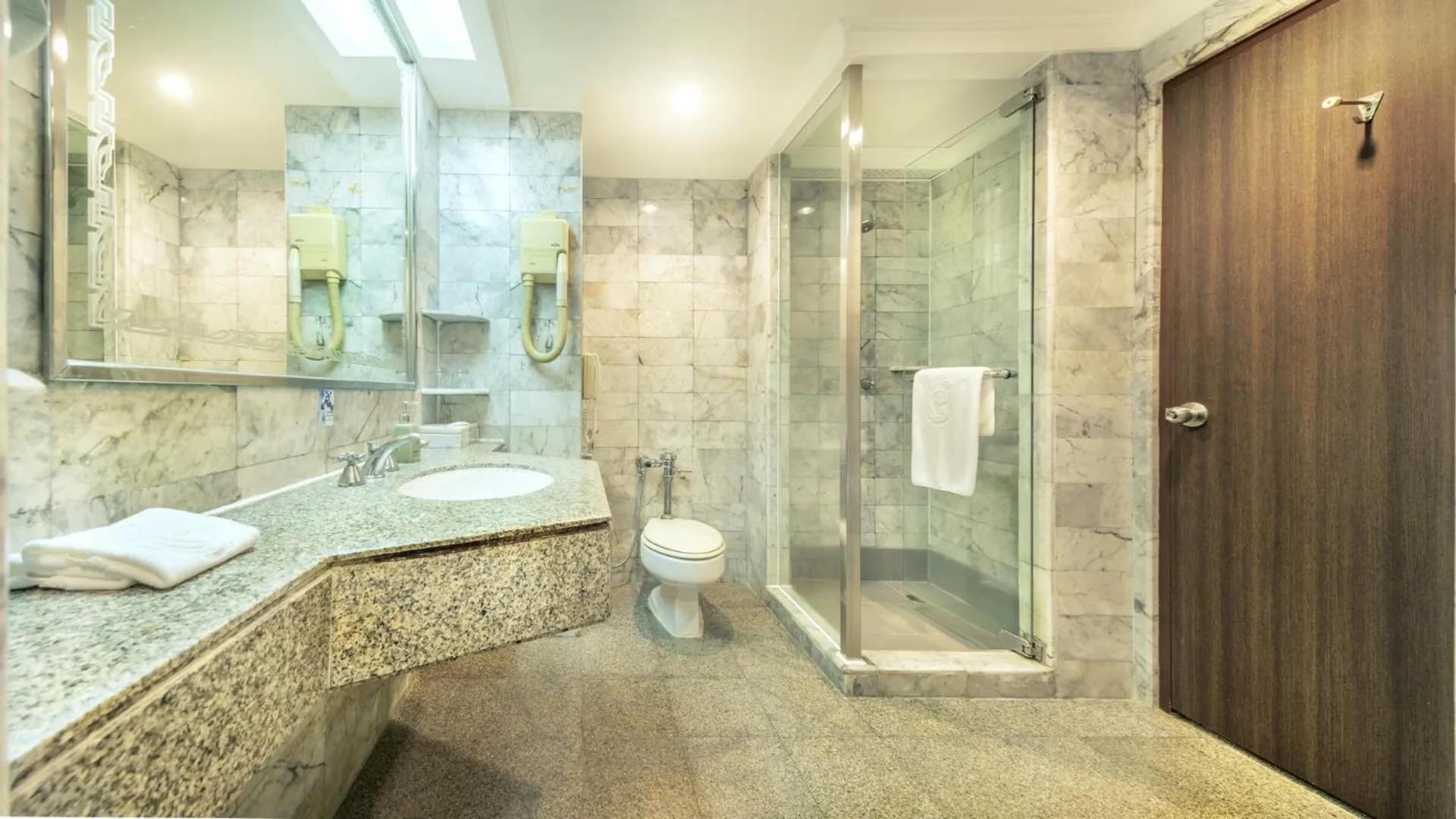 Bathroom in Ramada by Wyndham Bangkok Chaophya Park