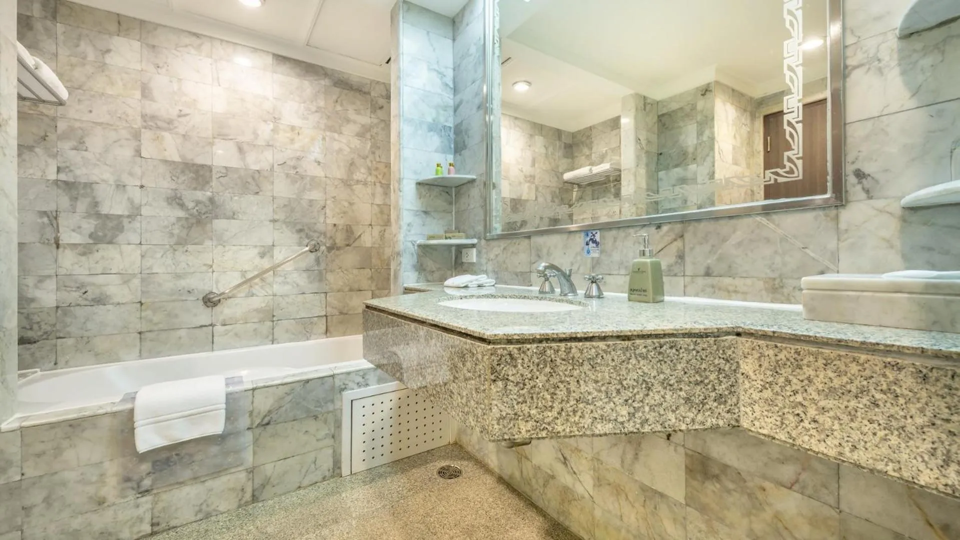 Bathroom in Ramada by Wyndham Bangkok Chaophya Park