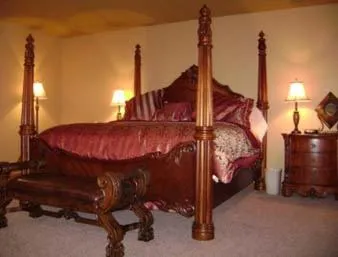 Bed in Sunset Inn & Suites