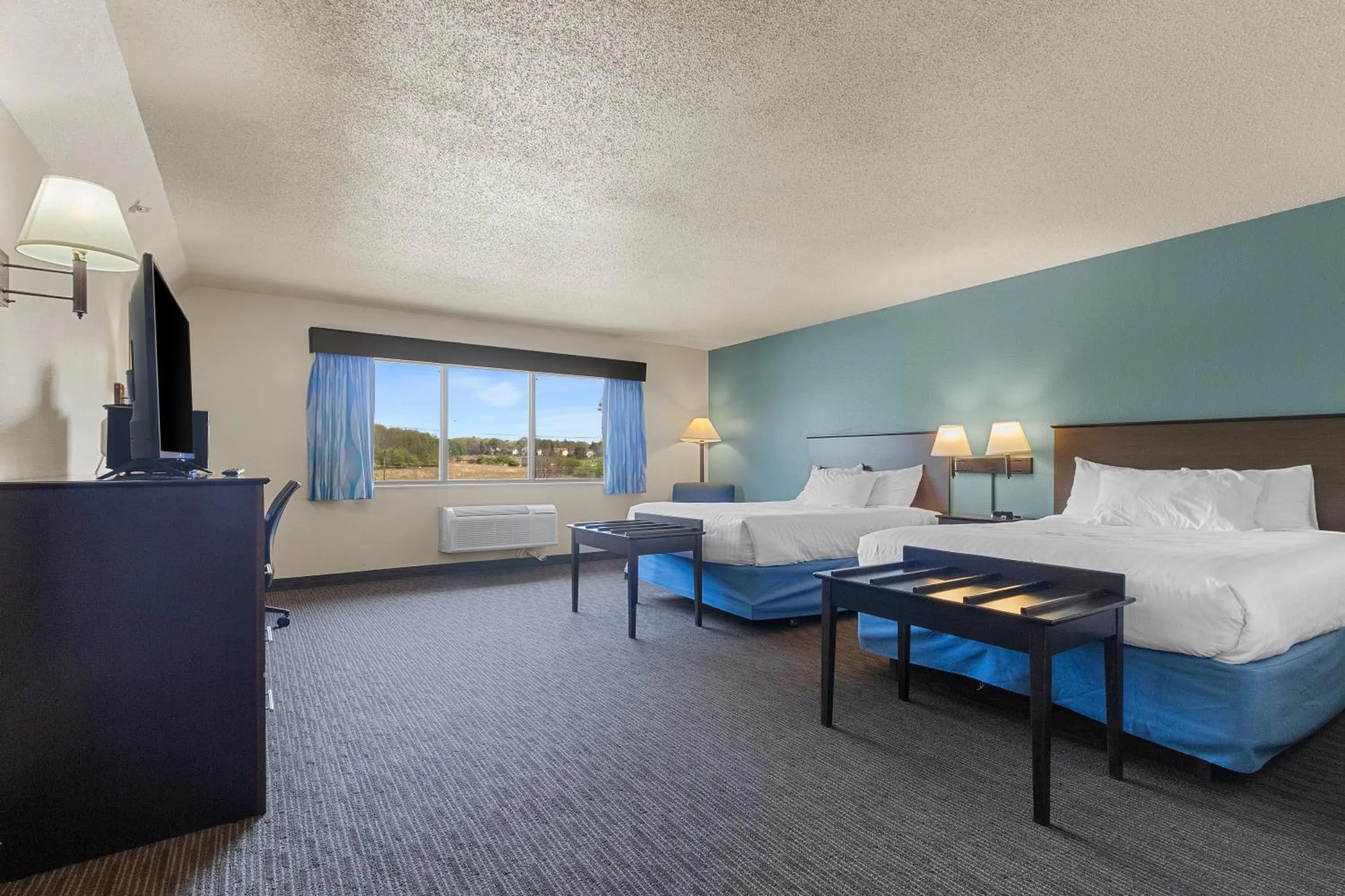 Bed in AmericInn by Wyndham Green Bay East