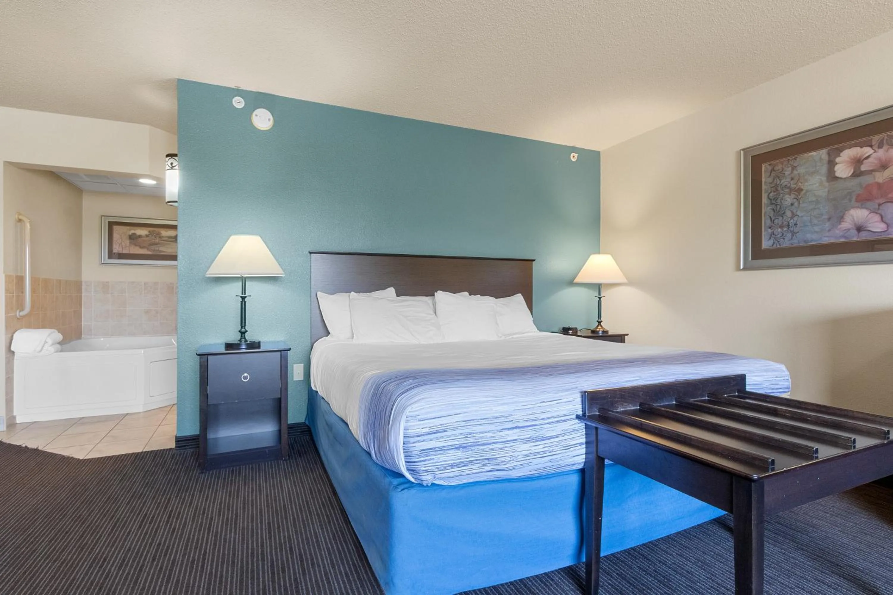 Bed in AmericInn by Wyndham Green Bay East