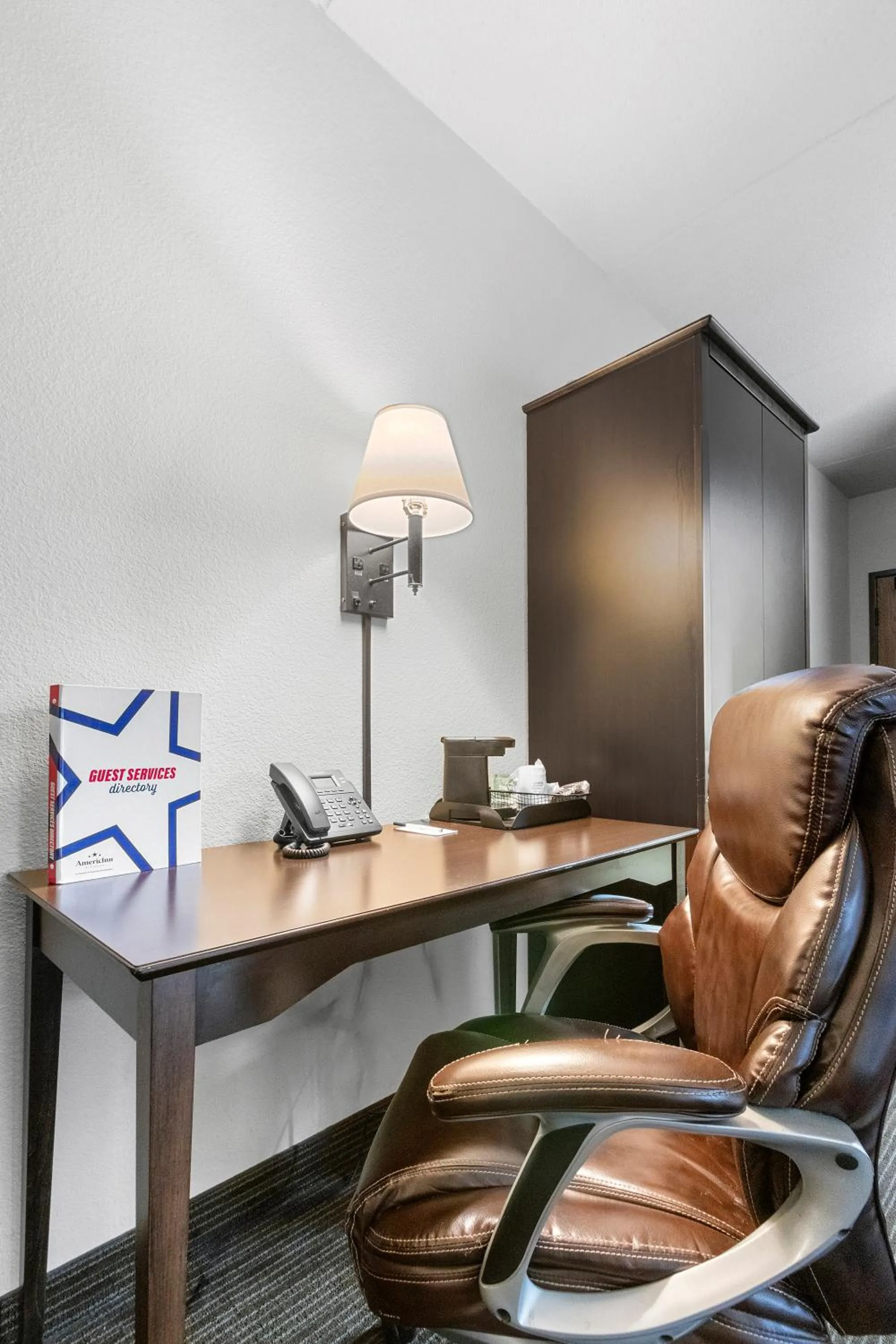 Seating area in AmericInn by Wyndham Green Bay East