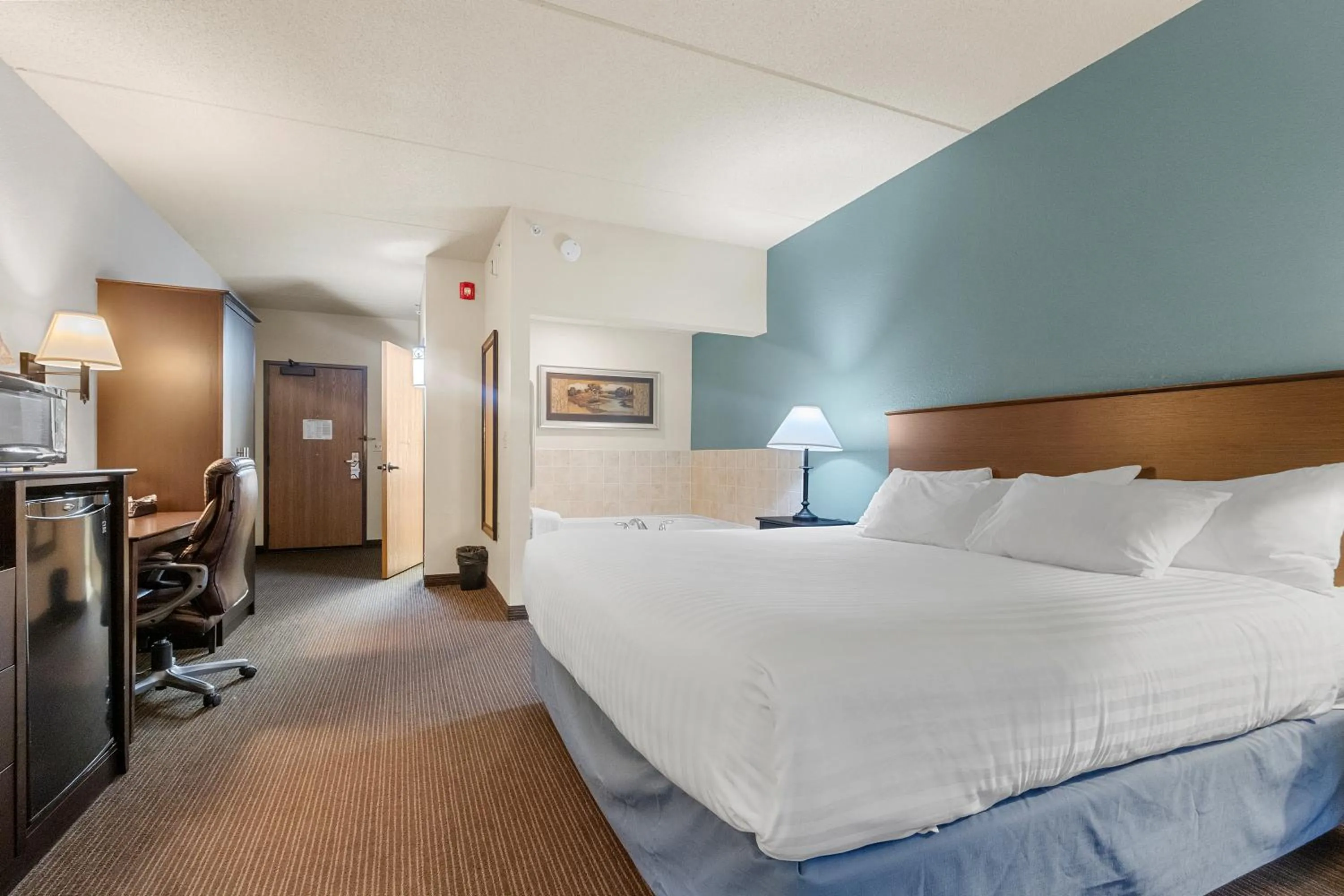 Bed in AmericInn by Wyndham Green Bay East