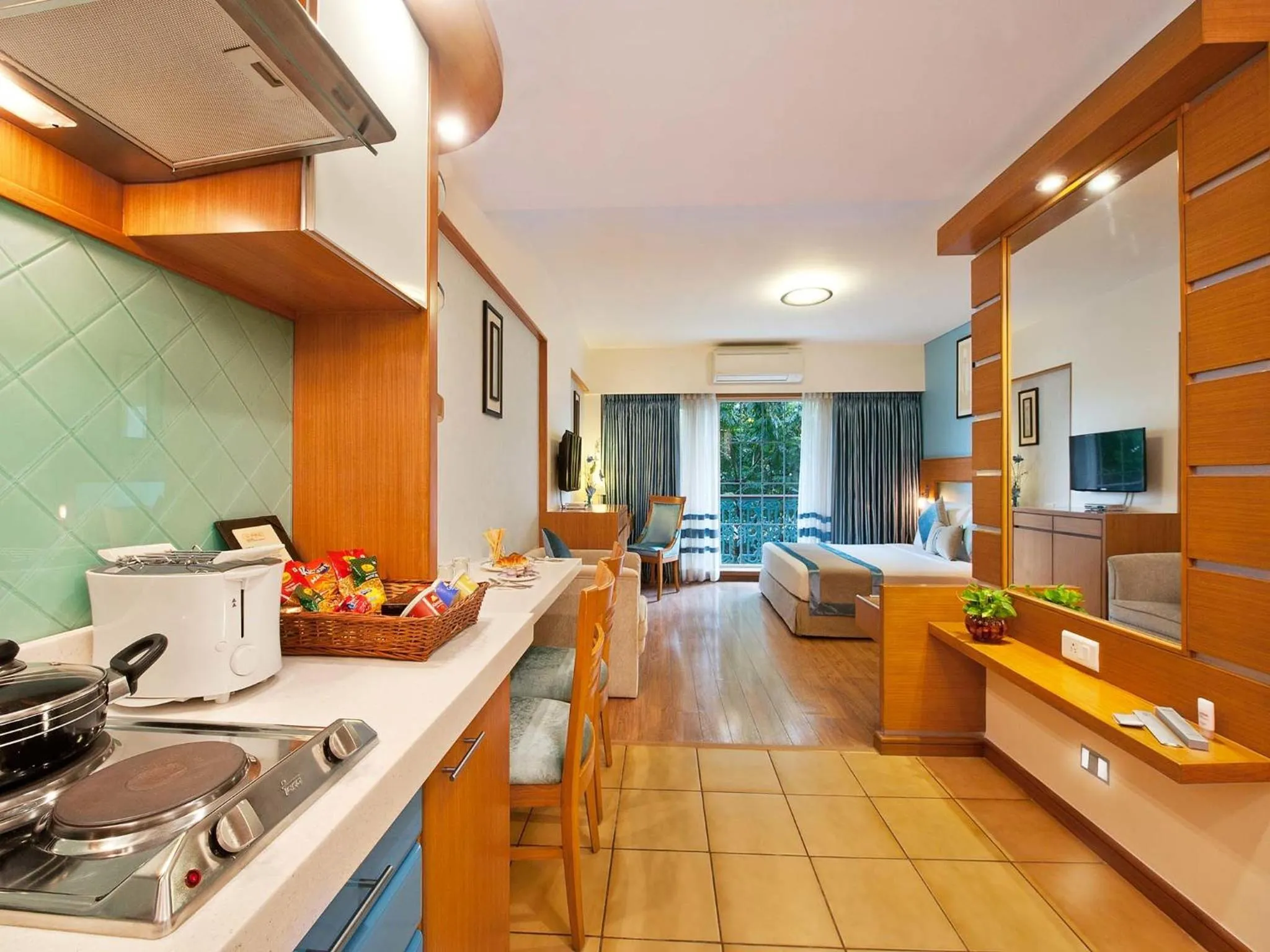 Kitchen or kitchenette in Grand Residency Hotel & Serviced Apartments