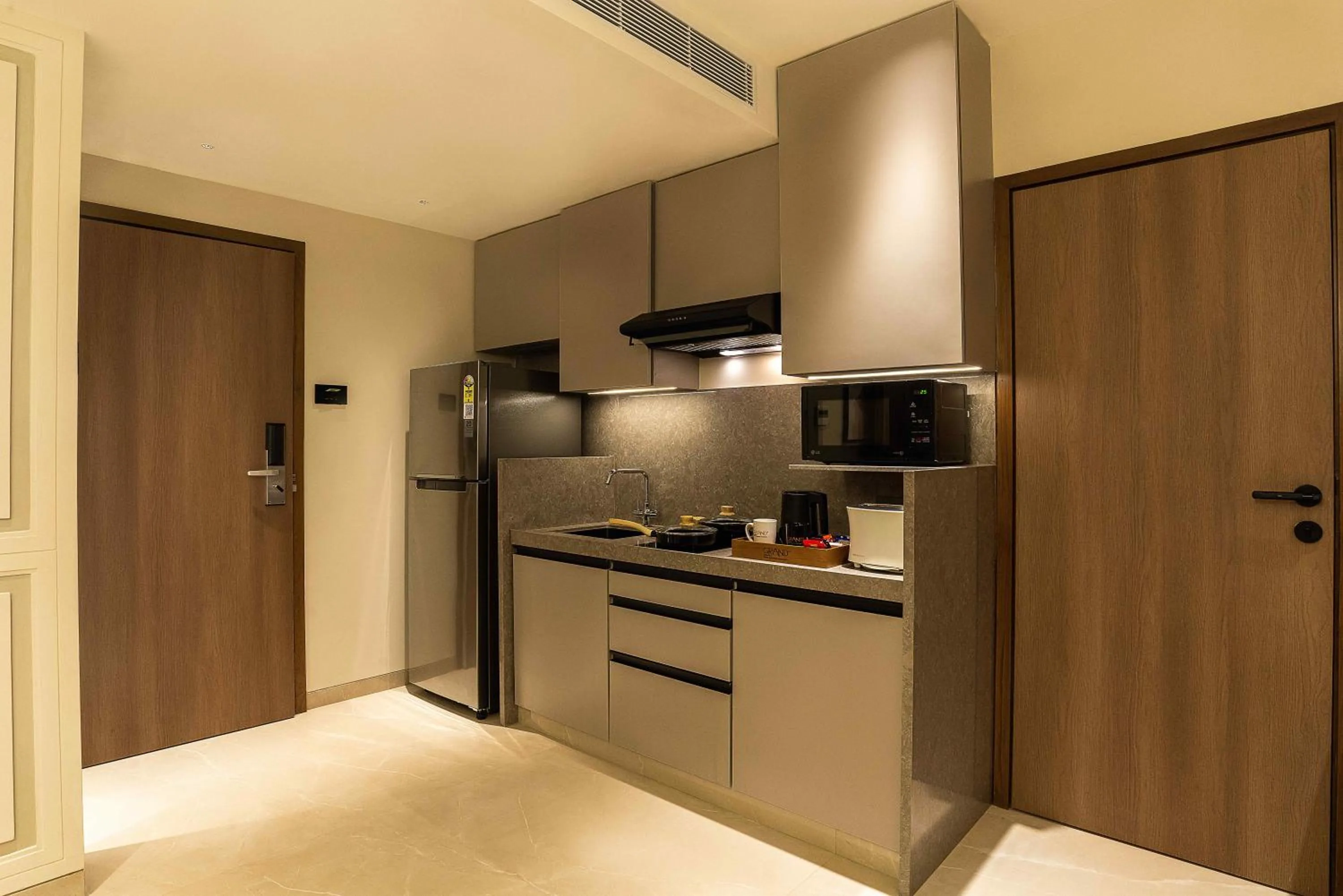 Kitchen or kitchenette in Grand Residency Hotel & Serviced Apartments