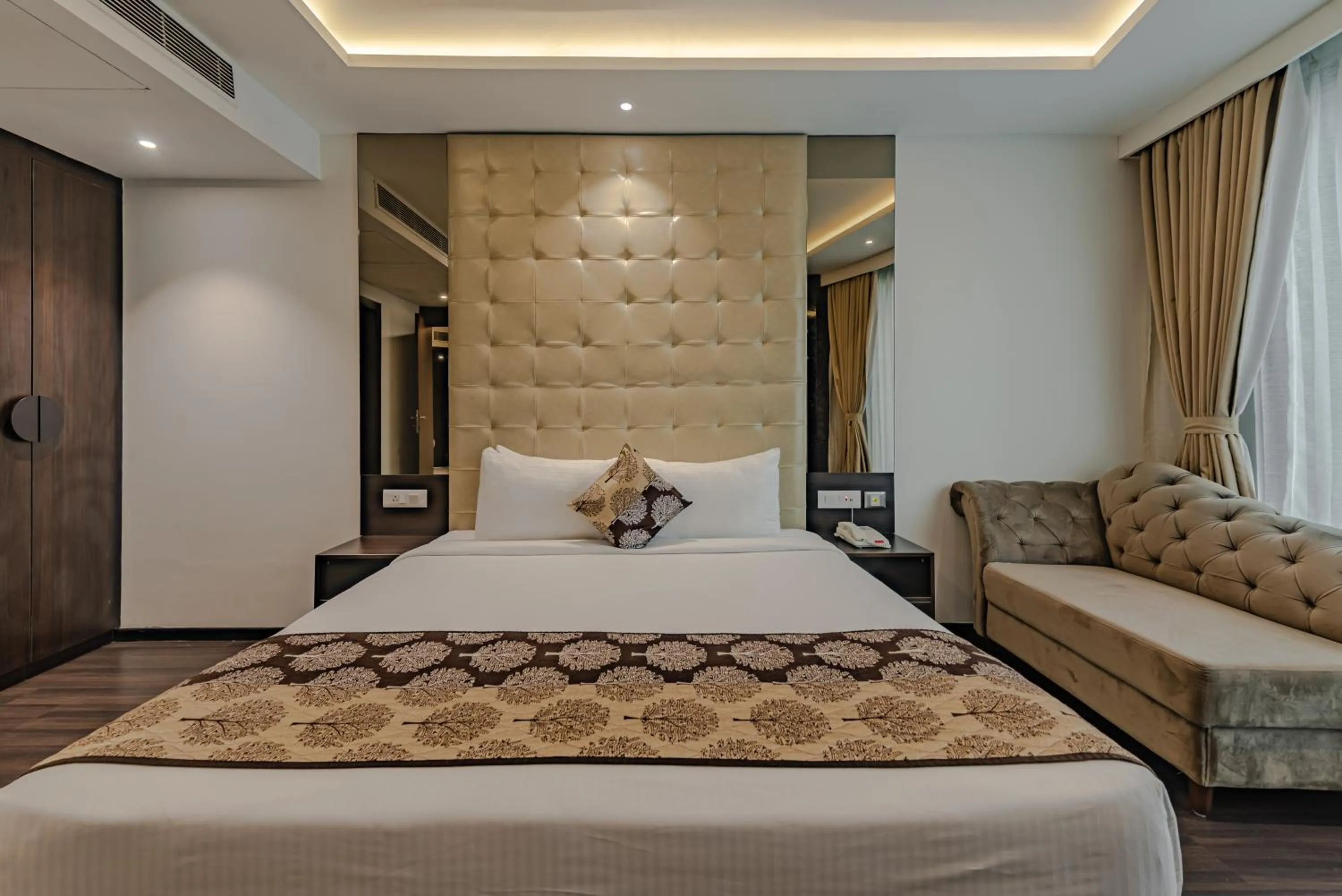 Bed in Goldfinch Hotel Mangalore