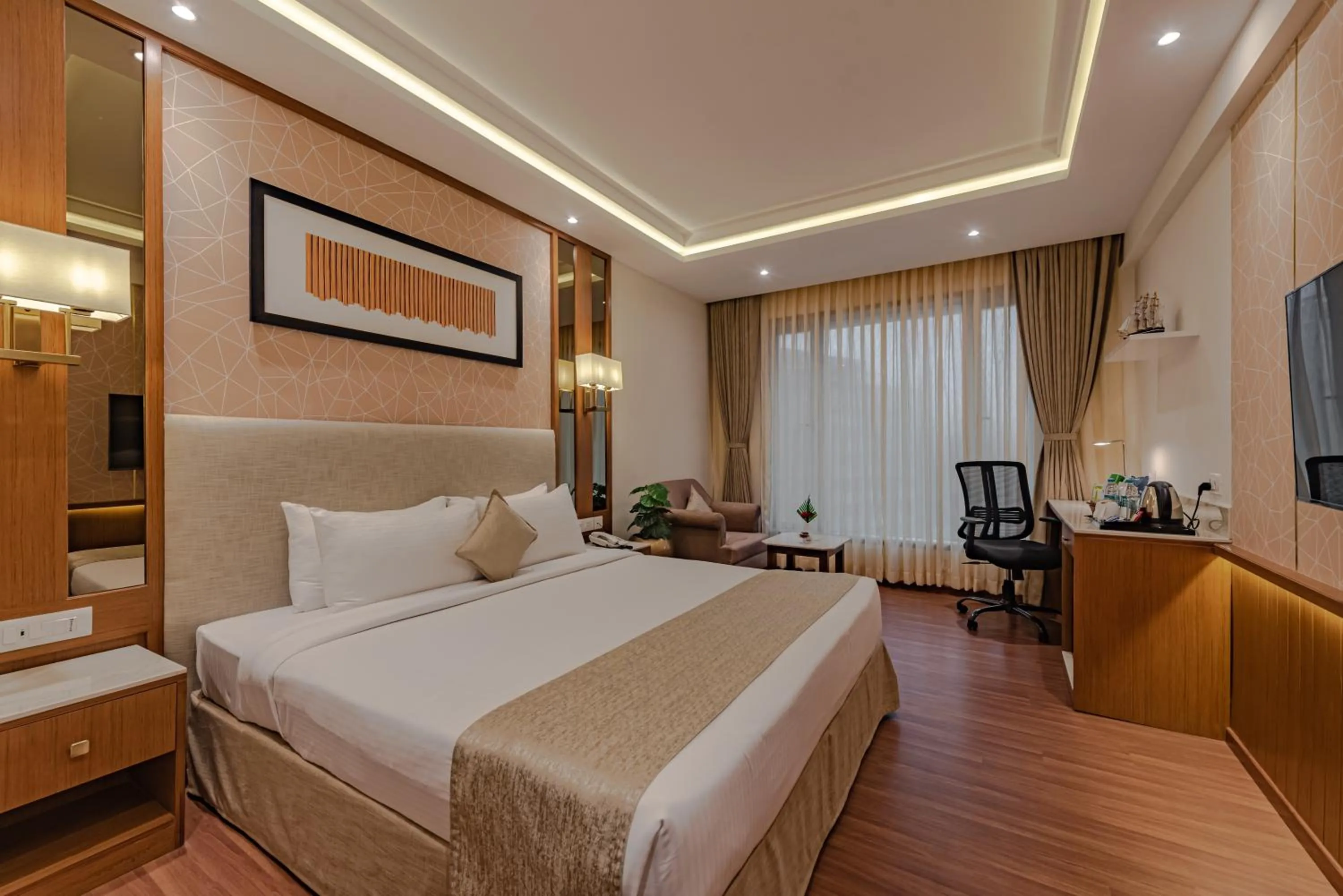 Bed in Goldfinch Hotel Mangalore