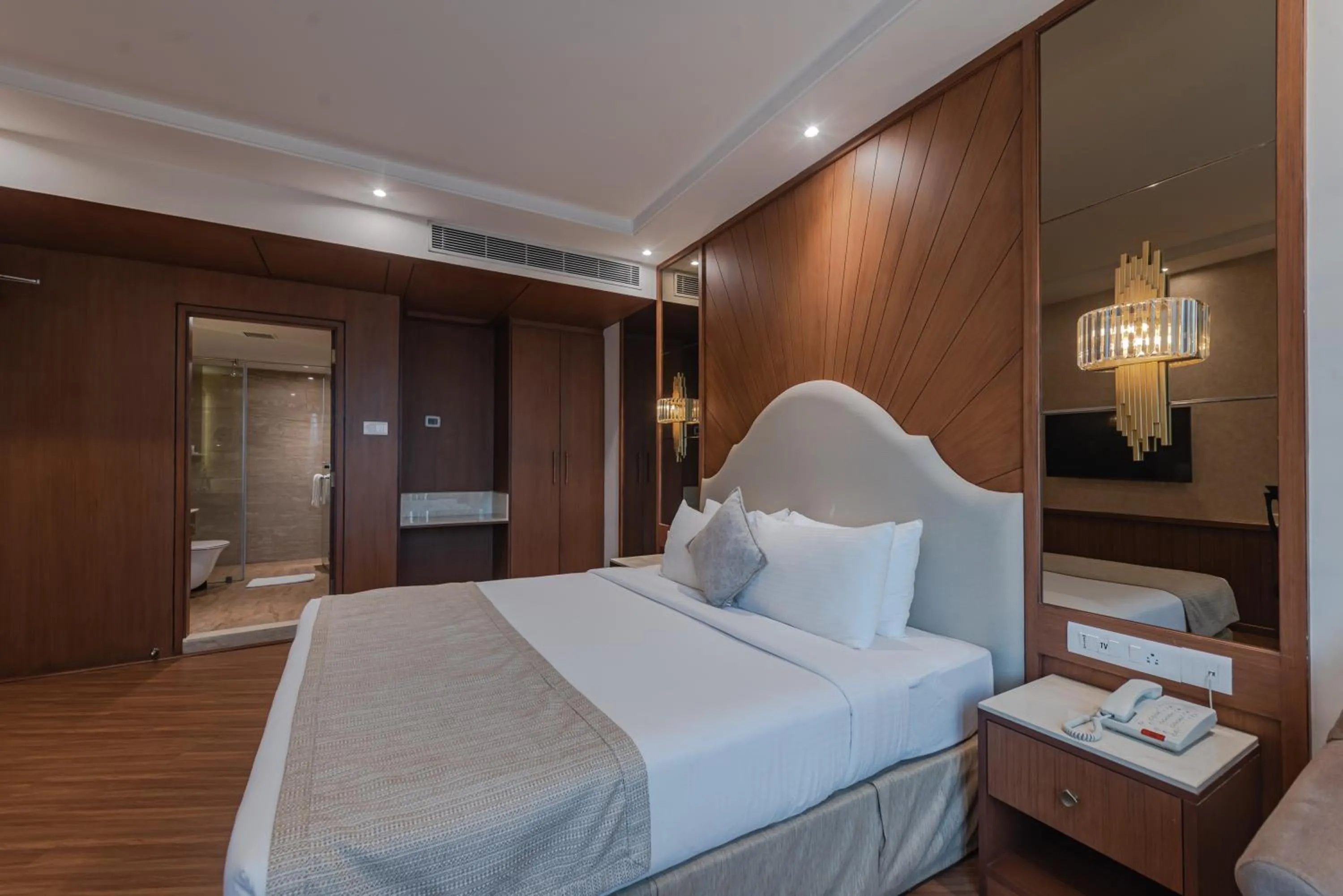 Bed in Goldfinch Hotel Mangalore