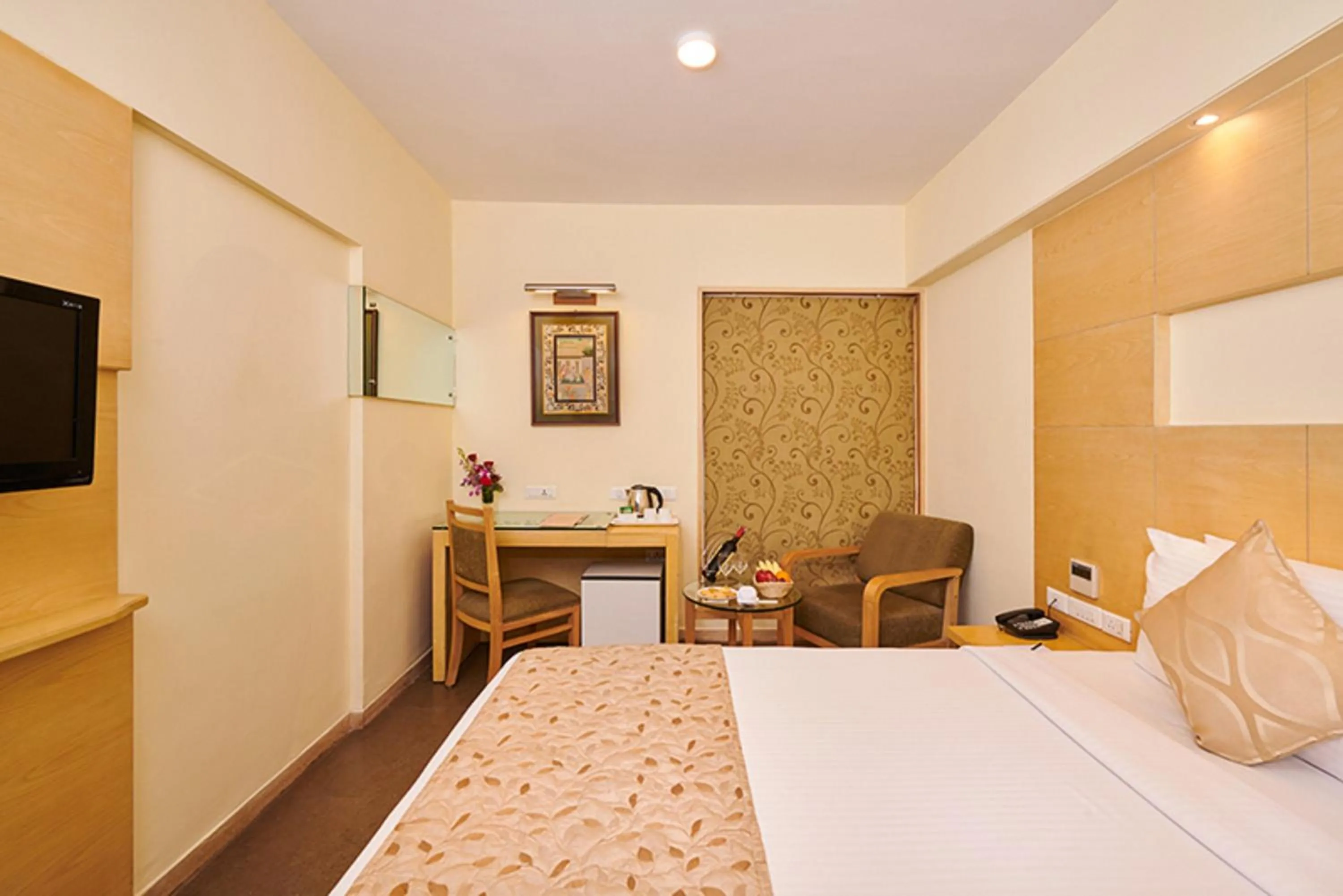 Bed in Coraltree Hotel Bangalore