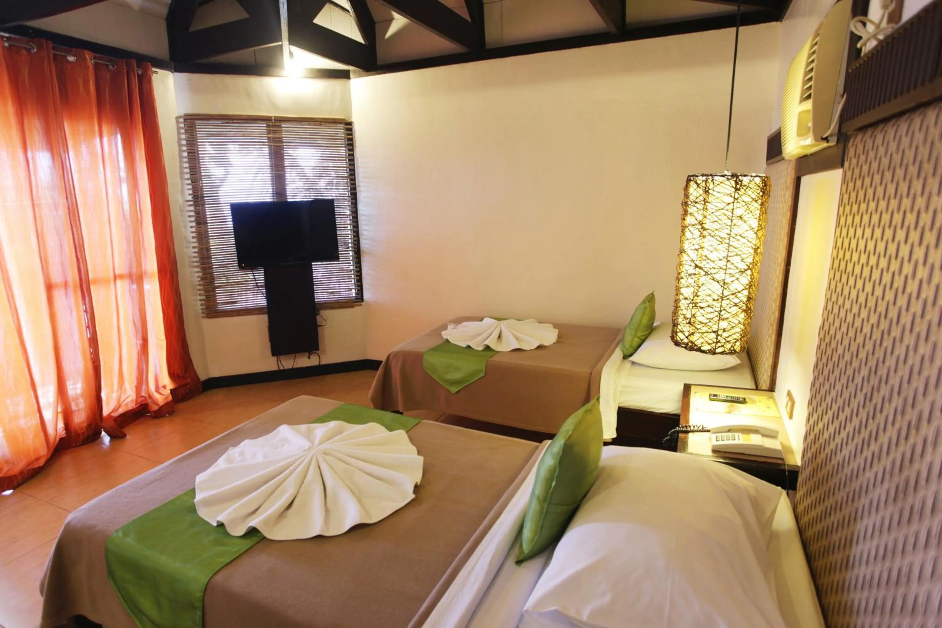 Bed in Eagle Point Beach and Dive Resort