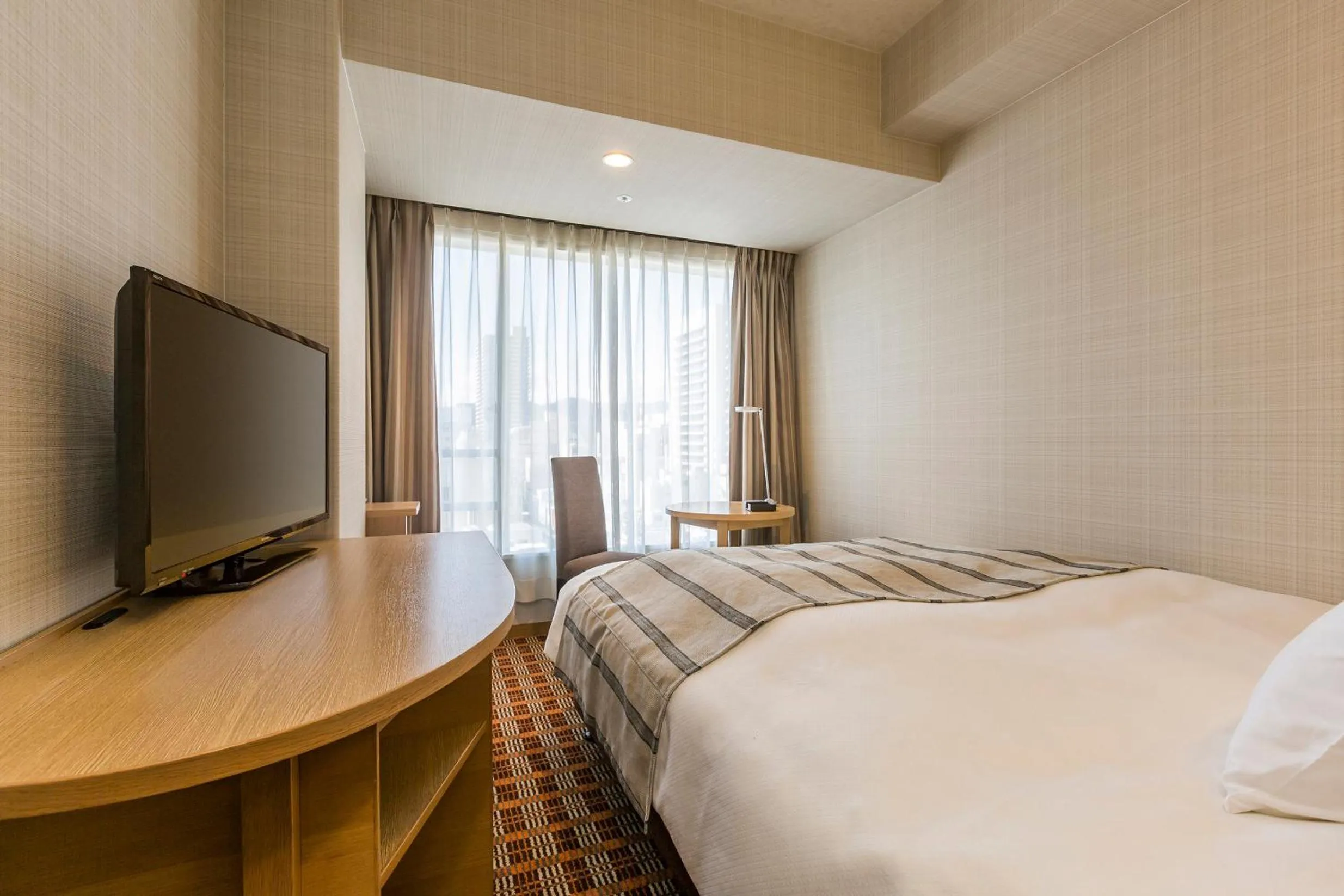 Bed in Garden Hotel Shizuoka