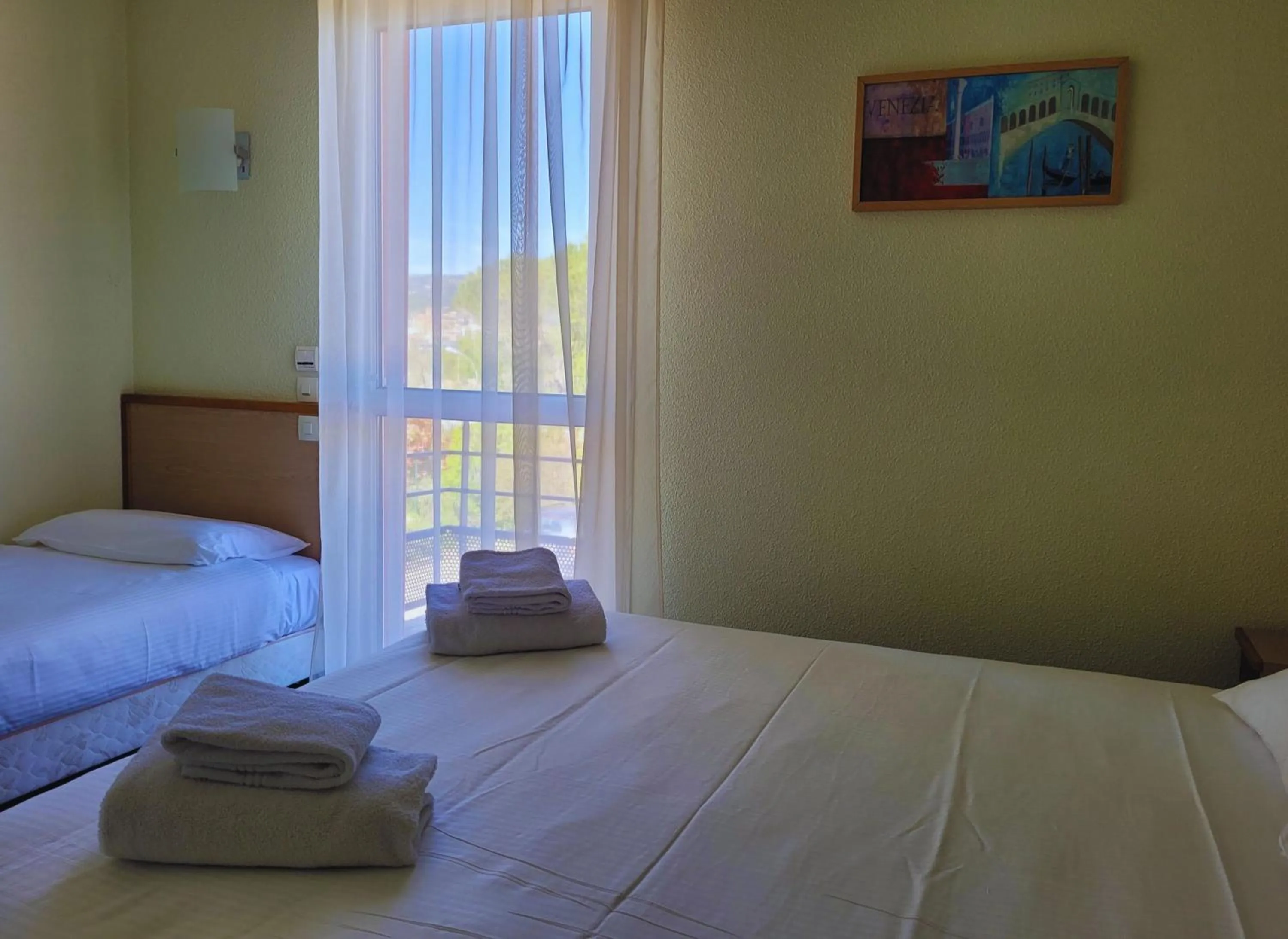 Bed in Hotel Restaurant Les Chataigniers