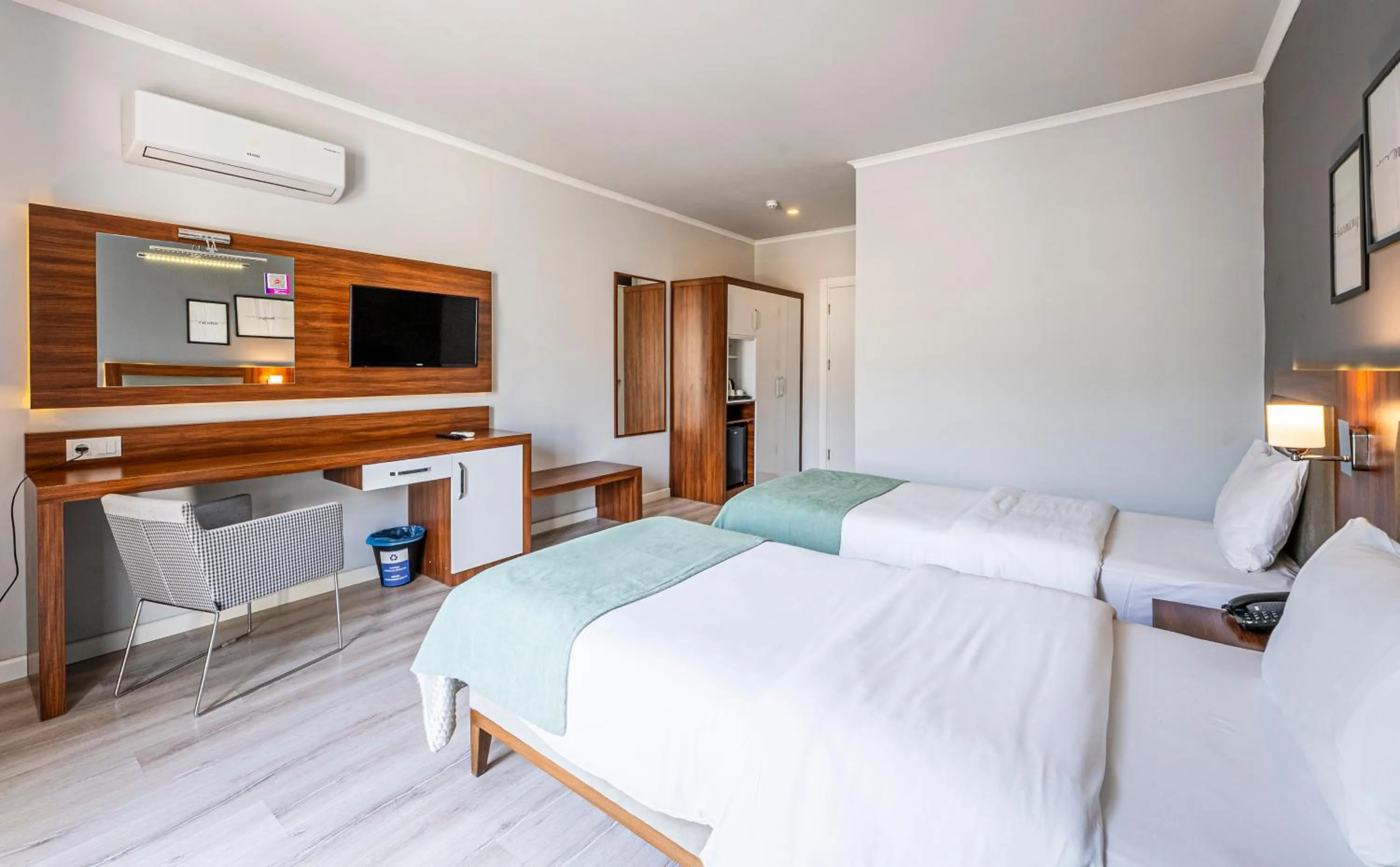 Bed in HMA Hotel & Suites