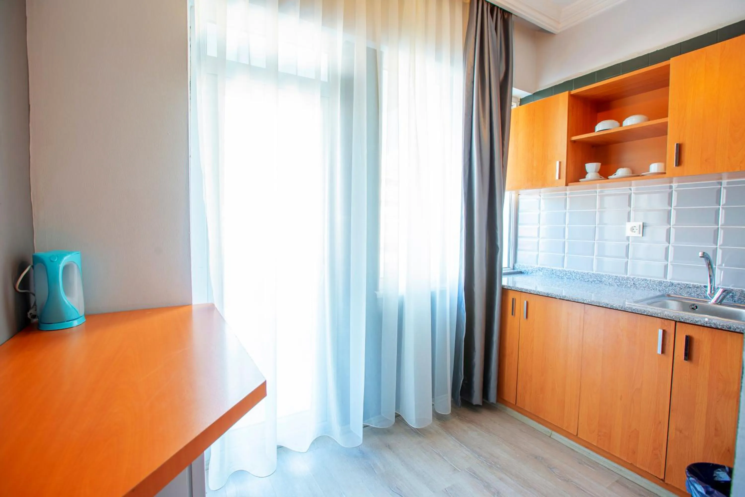 Kitchen or kitchenette in HMA Hotel & Suites