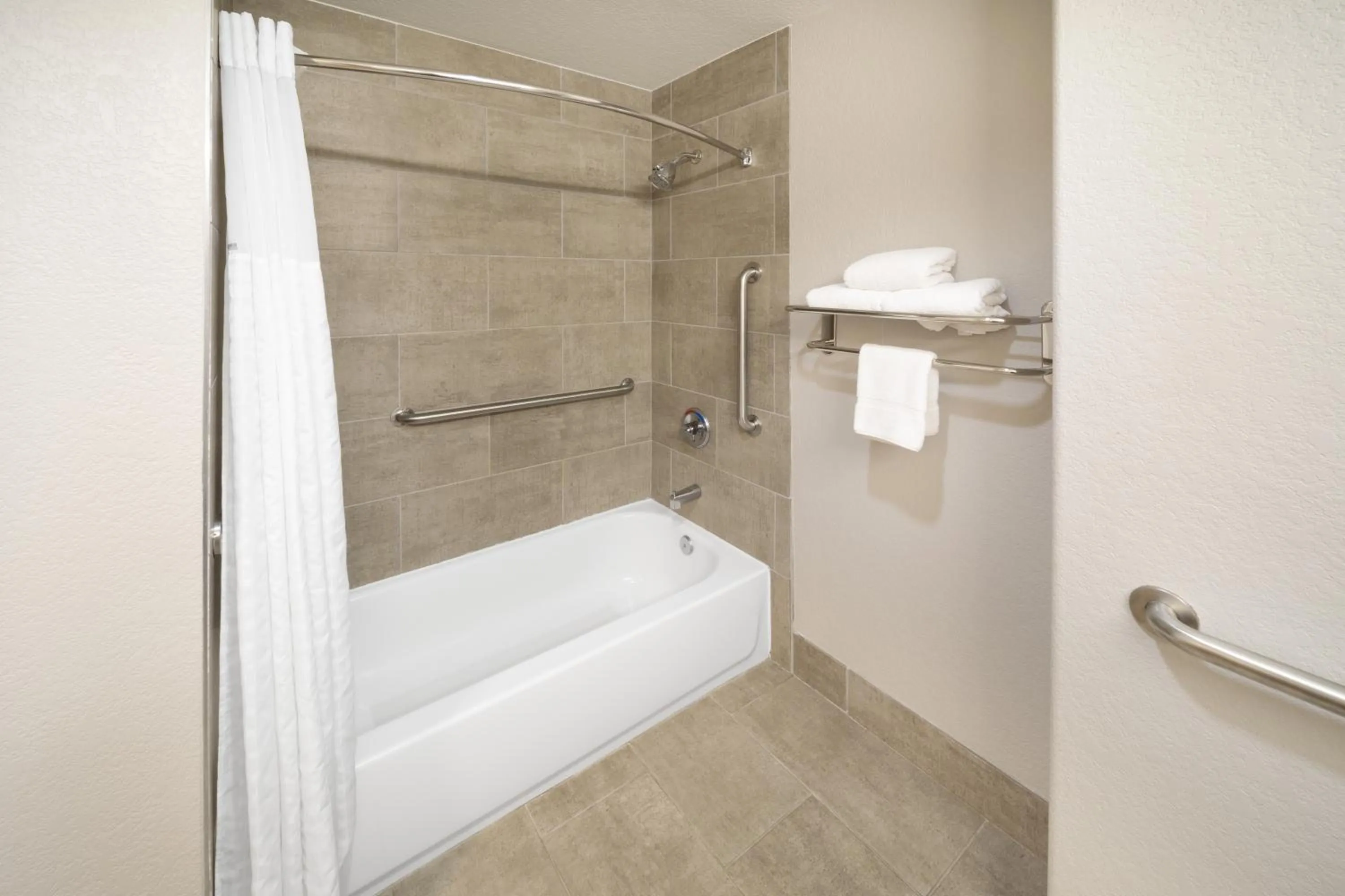 Bathroom in Days Inn & Suites by Wyndham San Antonio near Frost Bank Center