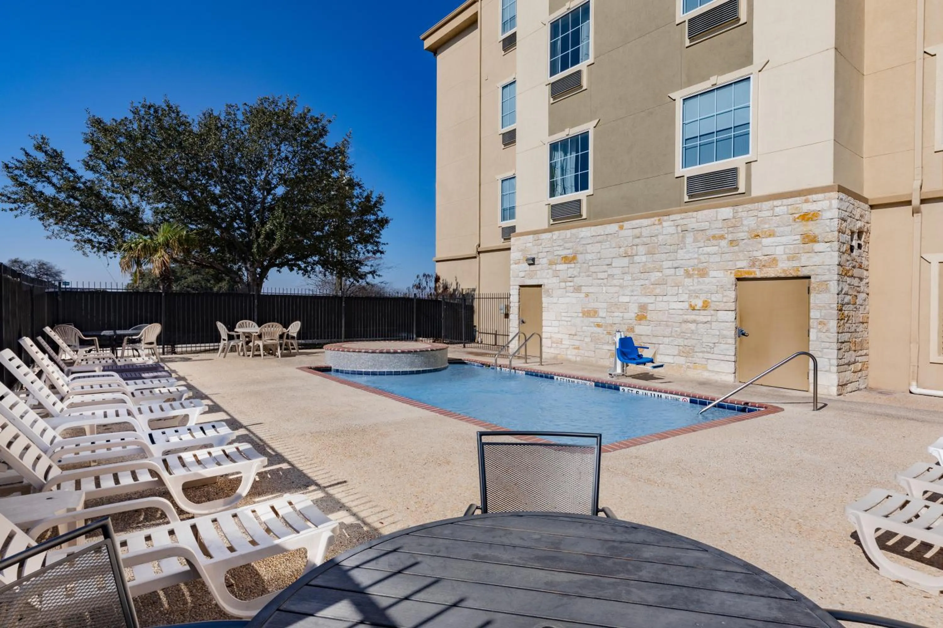 Swimming pool in Days Inn & Suites by Wyndham San Antonio near Frost Bank Center