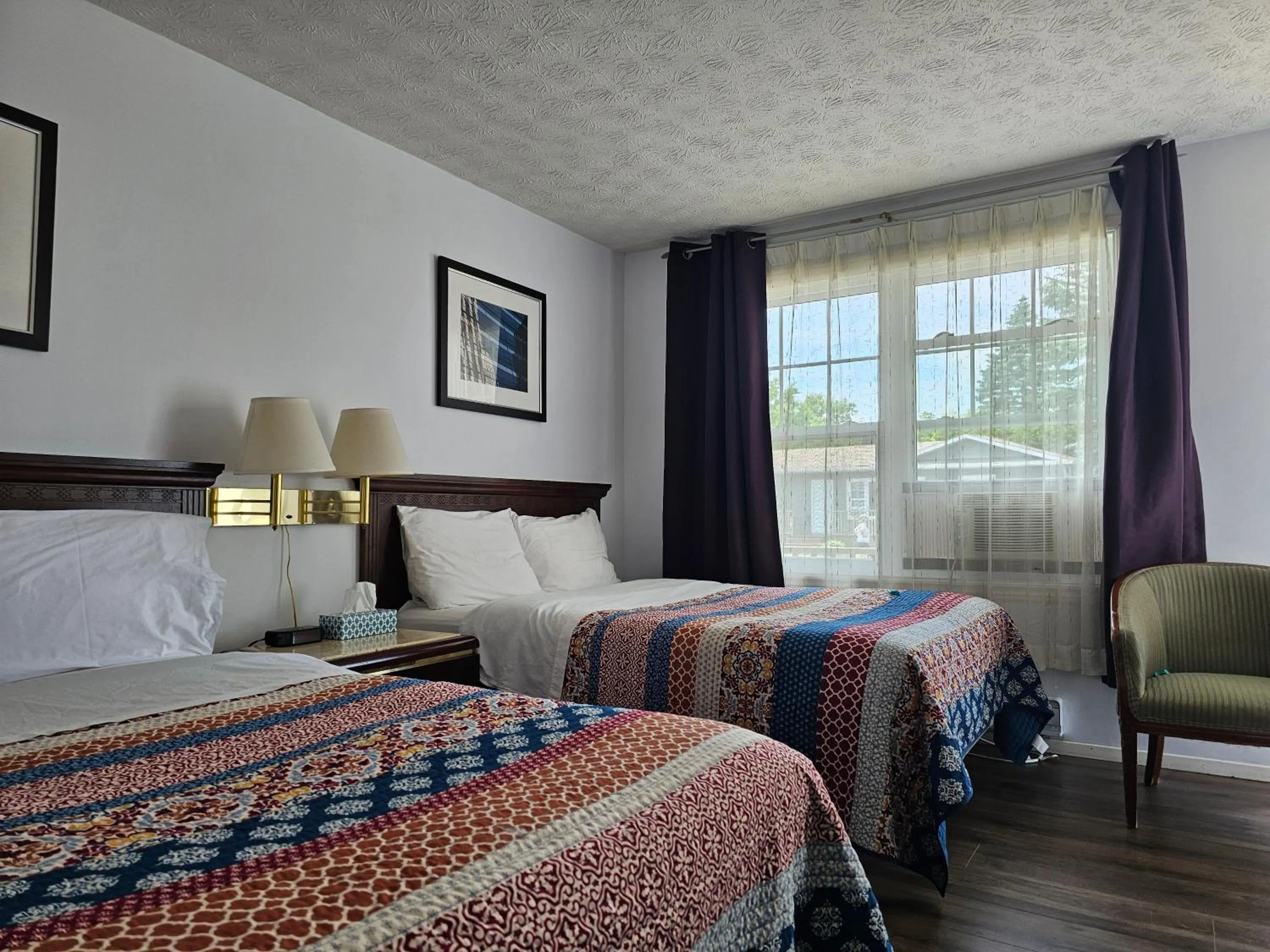 Bed in Motel de l'Outlet