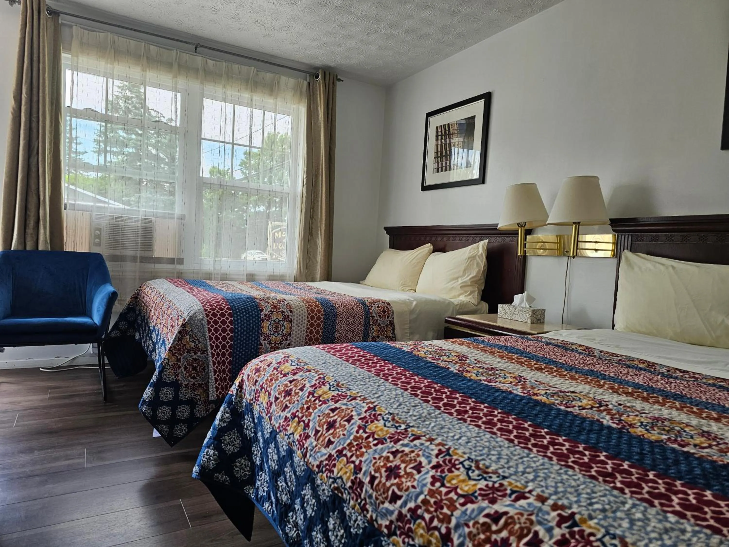 Bed in Motel de l'Outlet