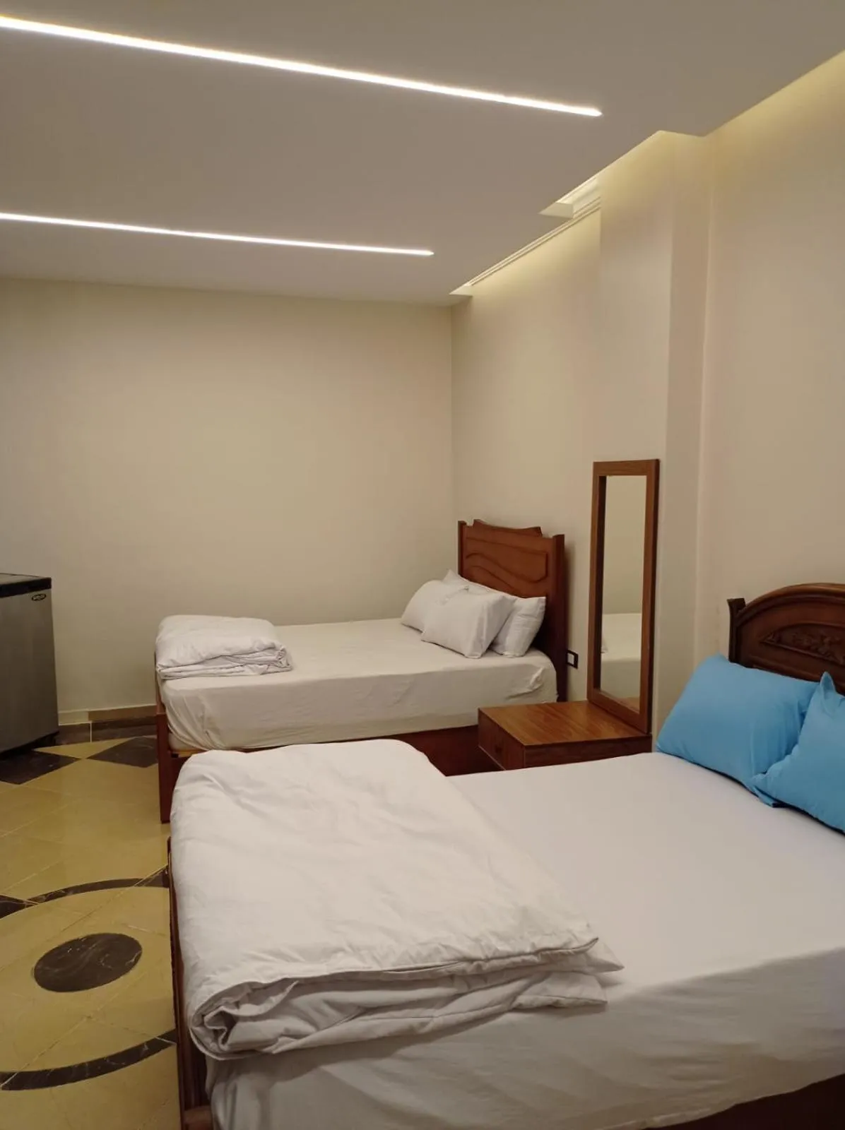 Bed in Royal Pyramids Inn