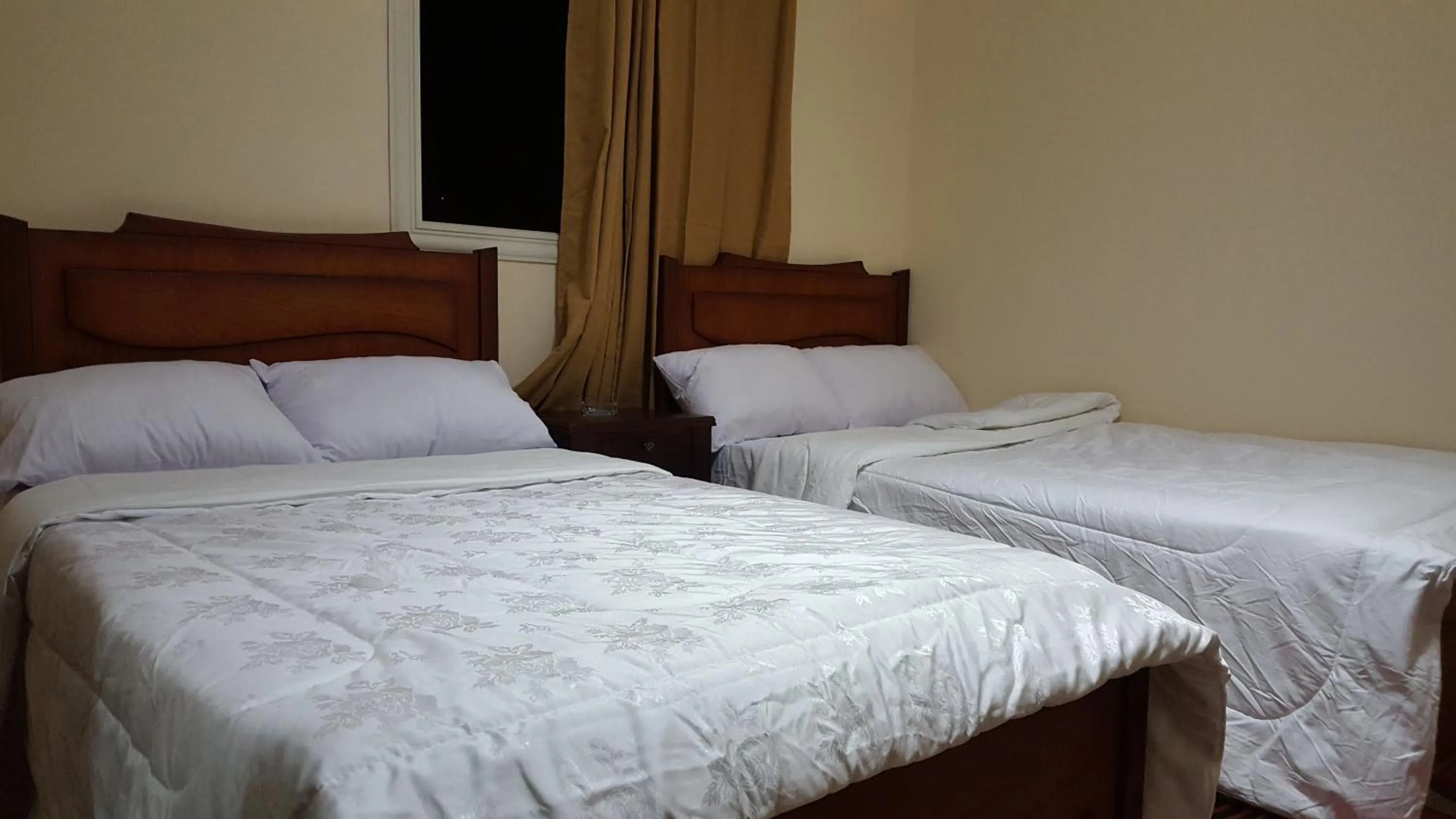 Bed in Royal Pyramids Inn