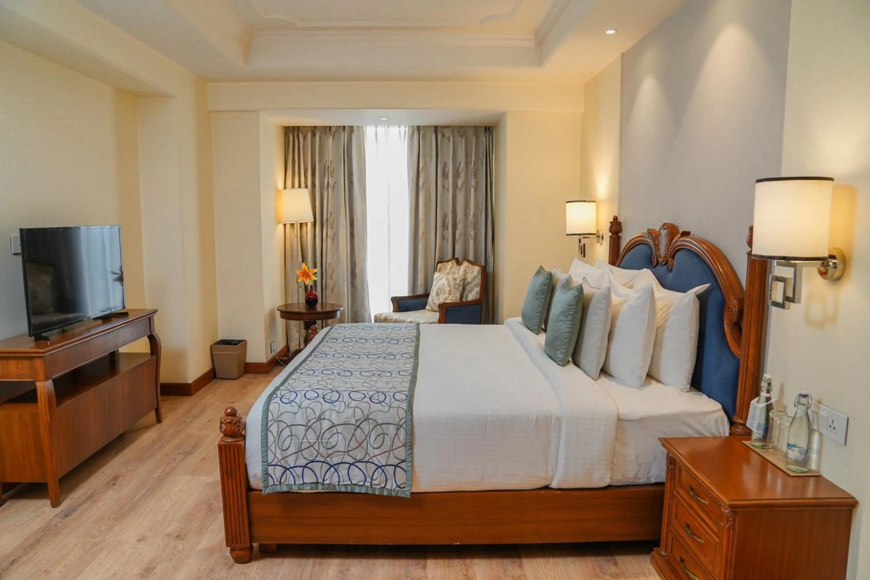 Photo of the whole room, Bed in Golden Sarovar Portico