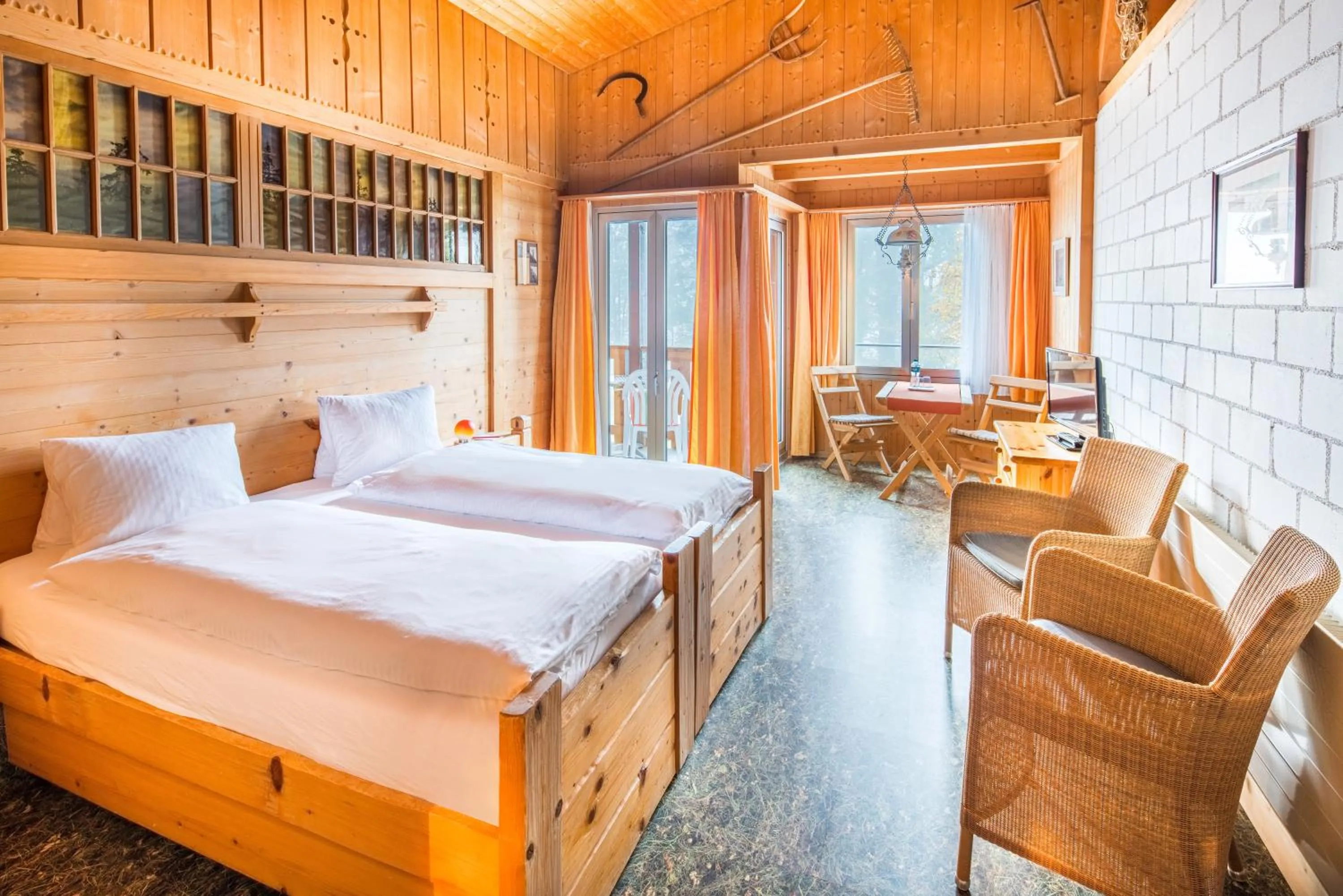 Seating area, Bed in Hotel Lindenhof by Crossworld AG