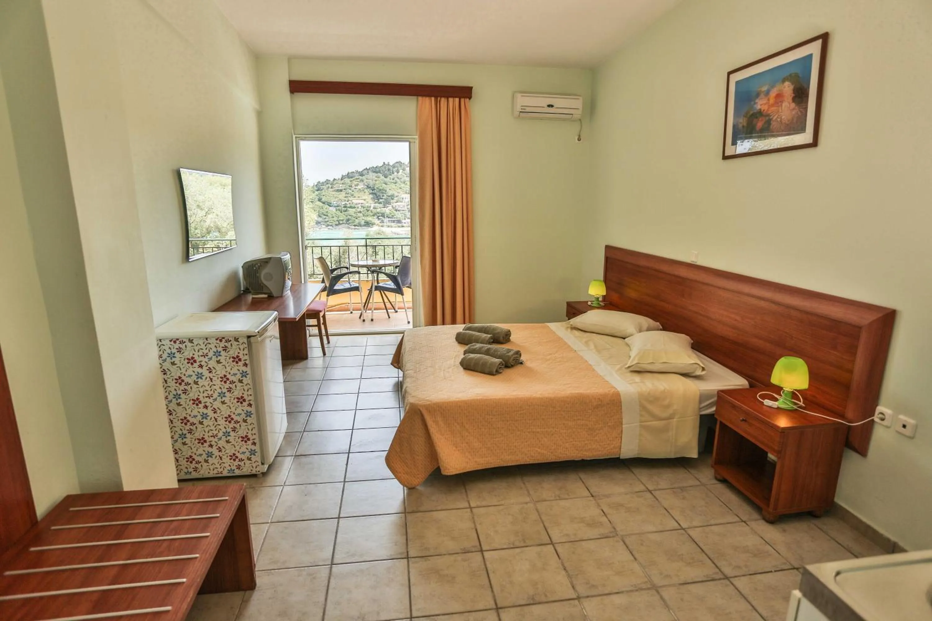 Bed in Amfitriti Hotel & Studios