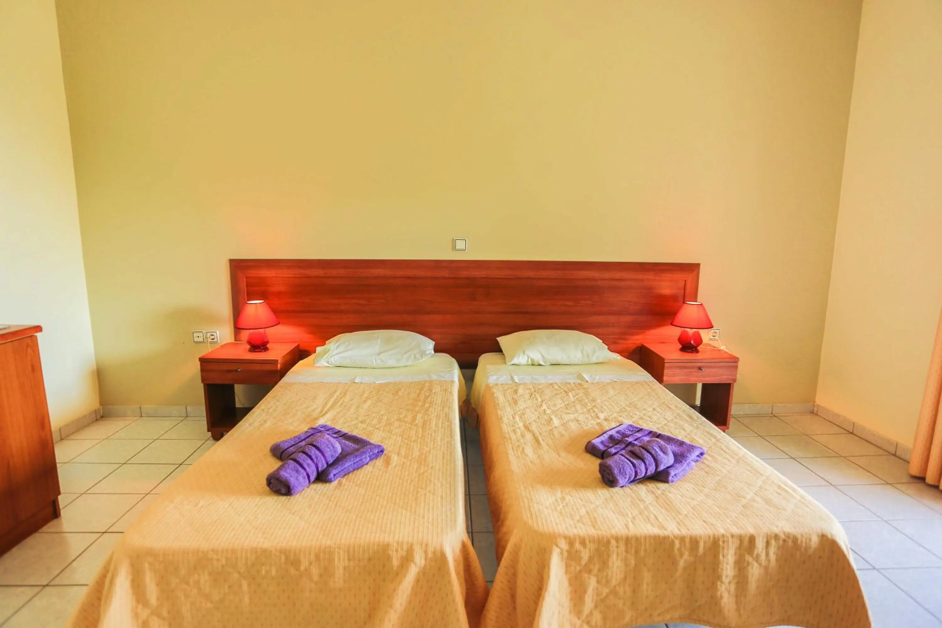 Bed in Amfitriti Hotel & Studios