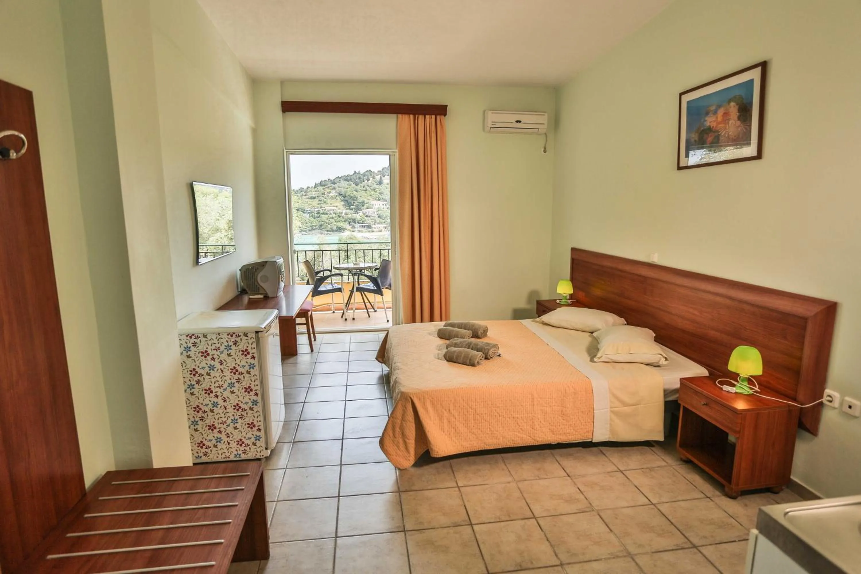 Bed in Amfitriti Hotel & Studios