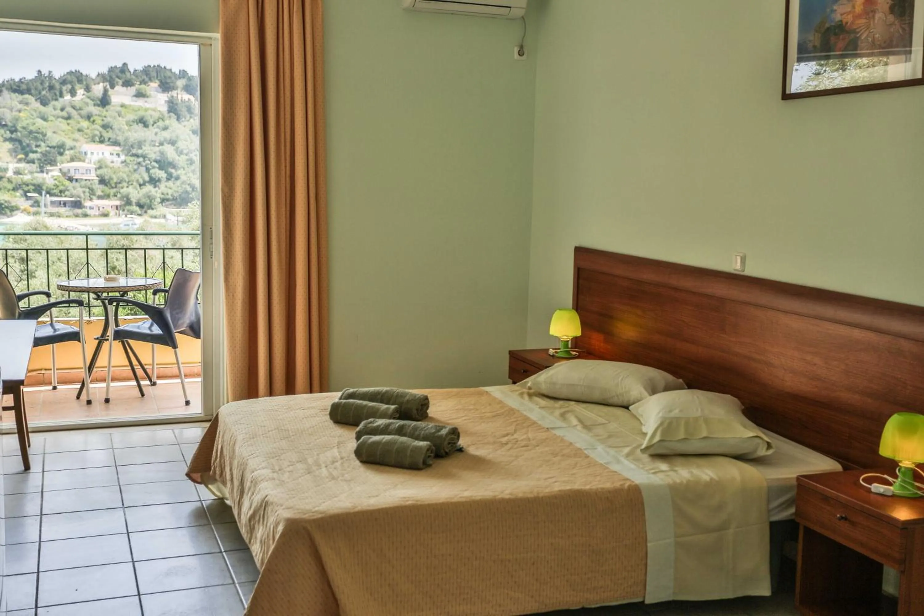 Bed in Amfitriti Hotel & Studios