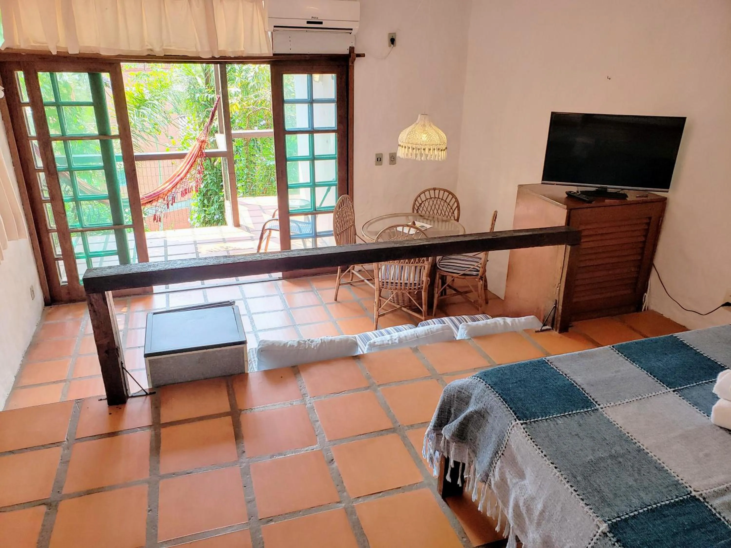 Communal lounge/ TV room, Bed in Pousada da Lagoinha