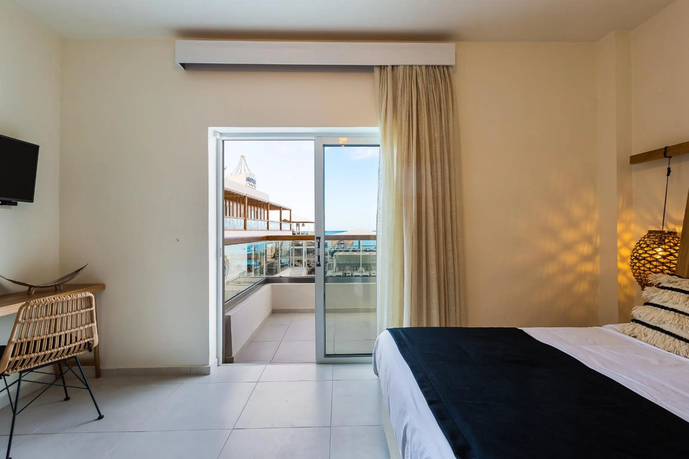 Balcony/Terrace, Bed in Nostos Beach Boutique Hotel