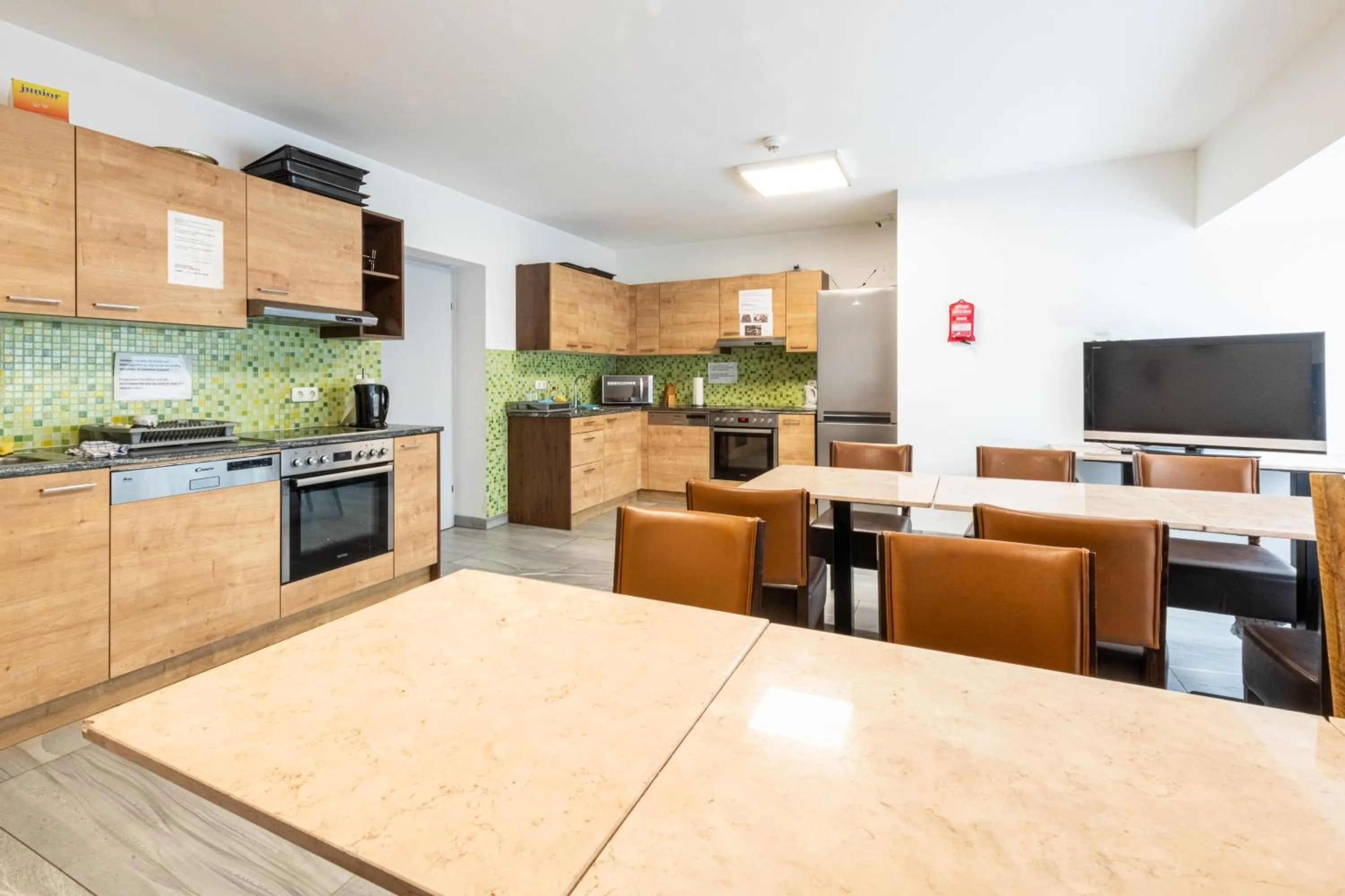 Communal lounge/ TV room in Wels Inn Hotel