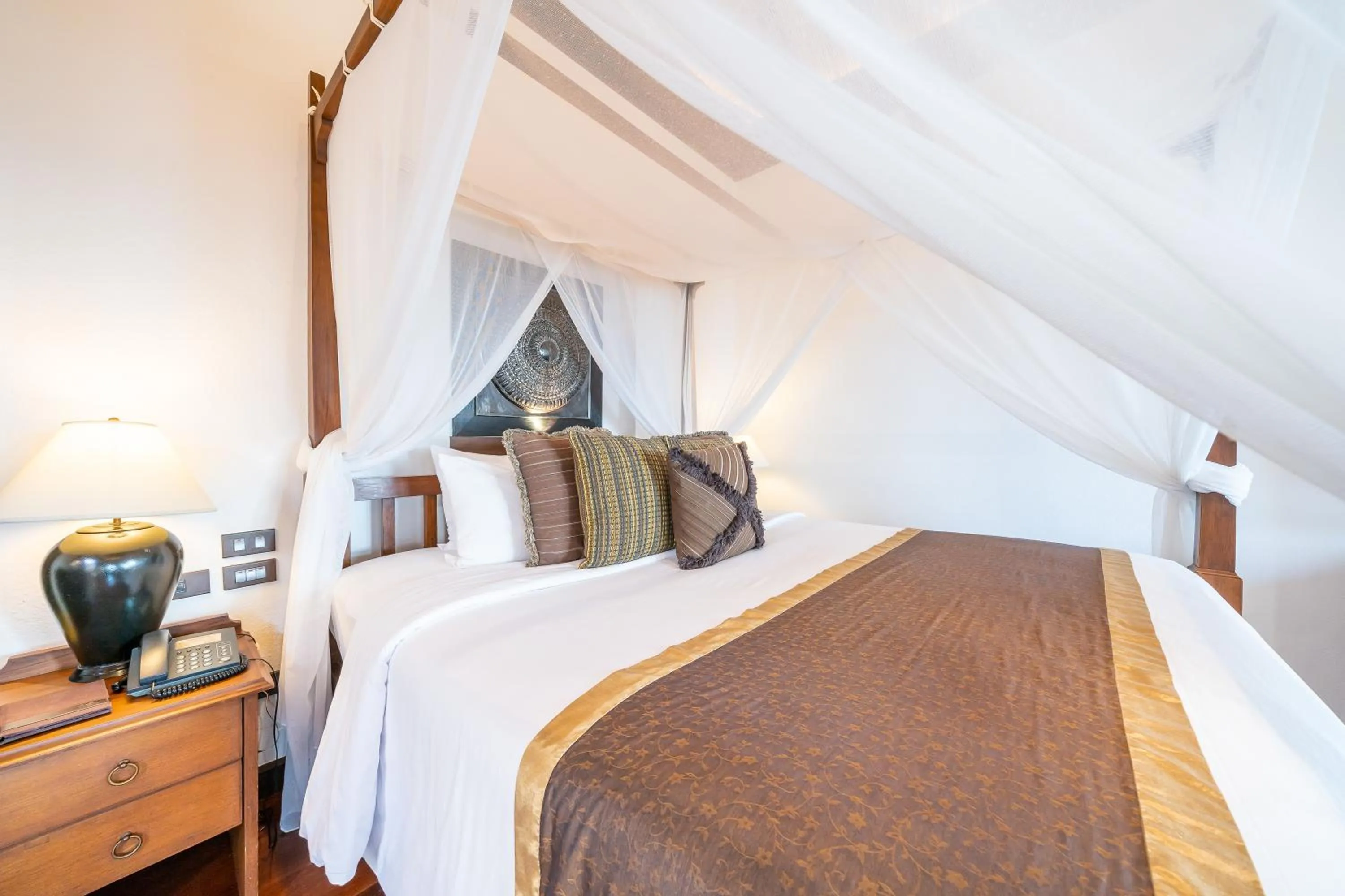 Bed in Le Vimarn Cottages & Spa