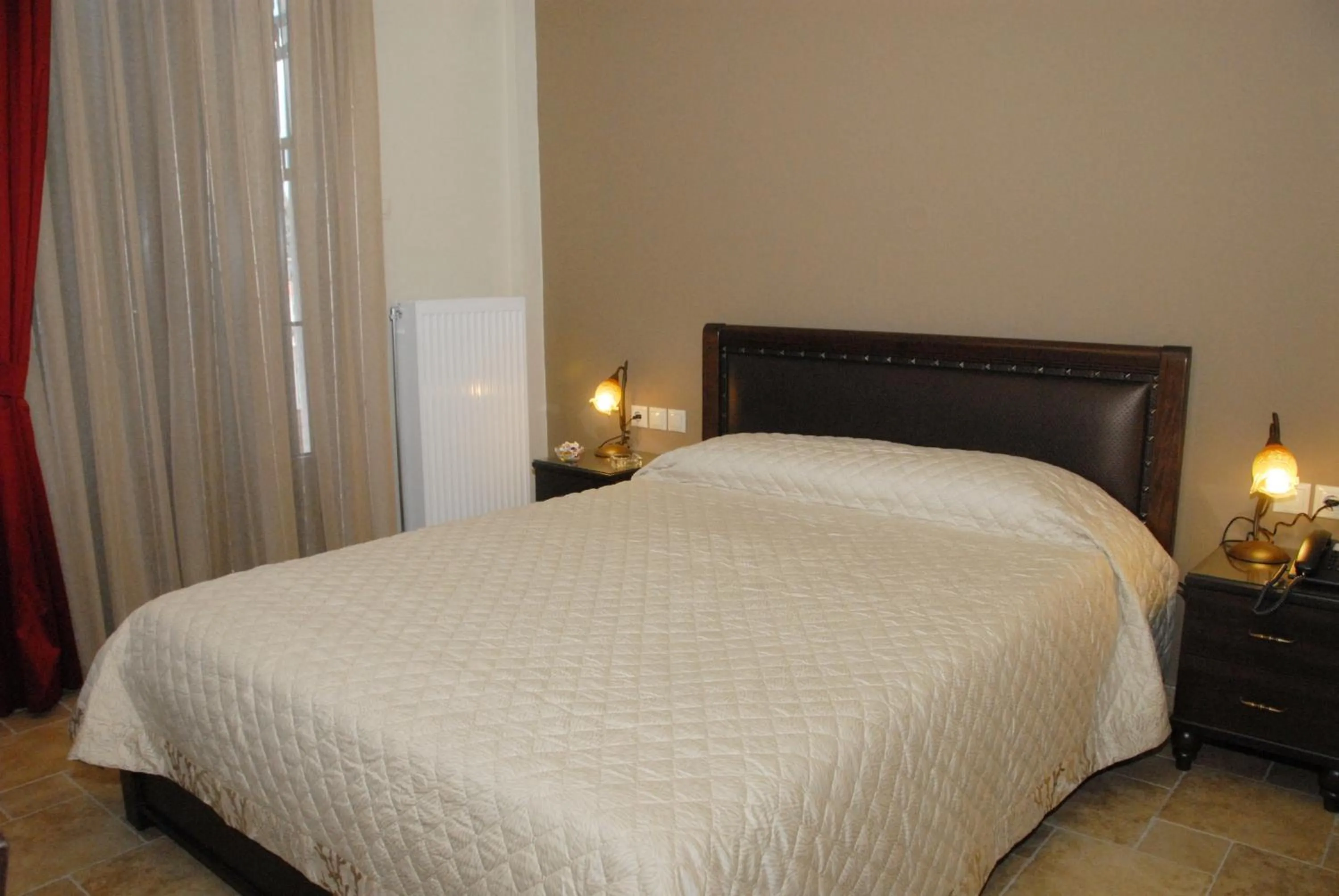 Bed in Hotel Filoxenia