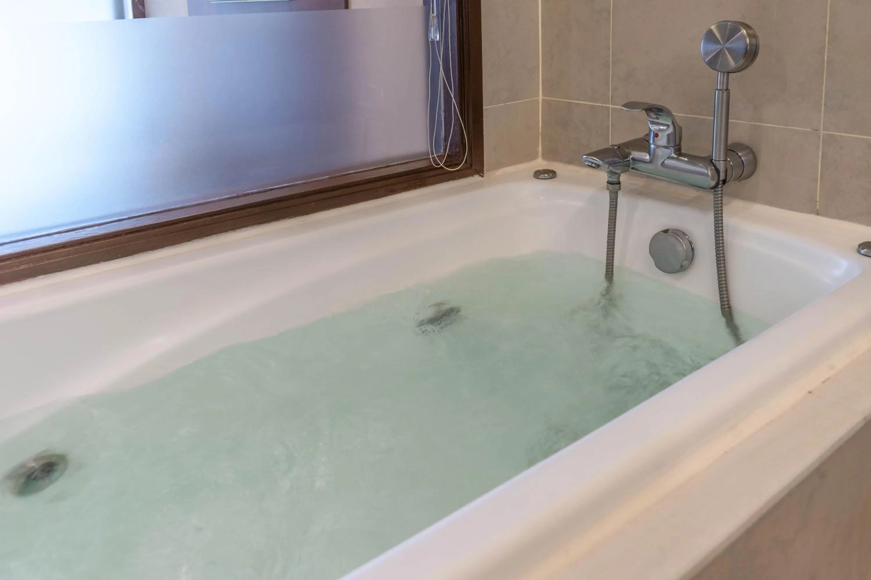 Bathroom in Jasmine City Hotel