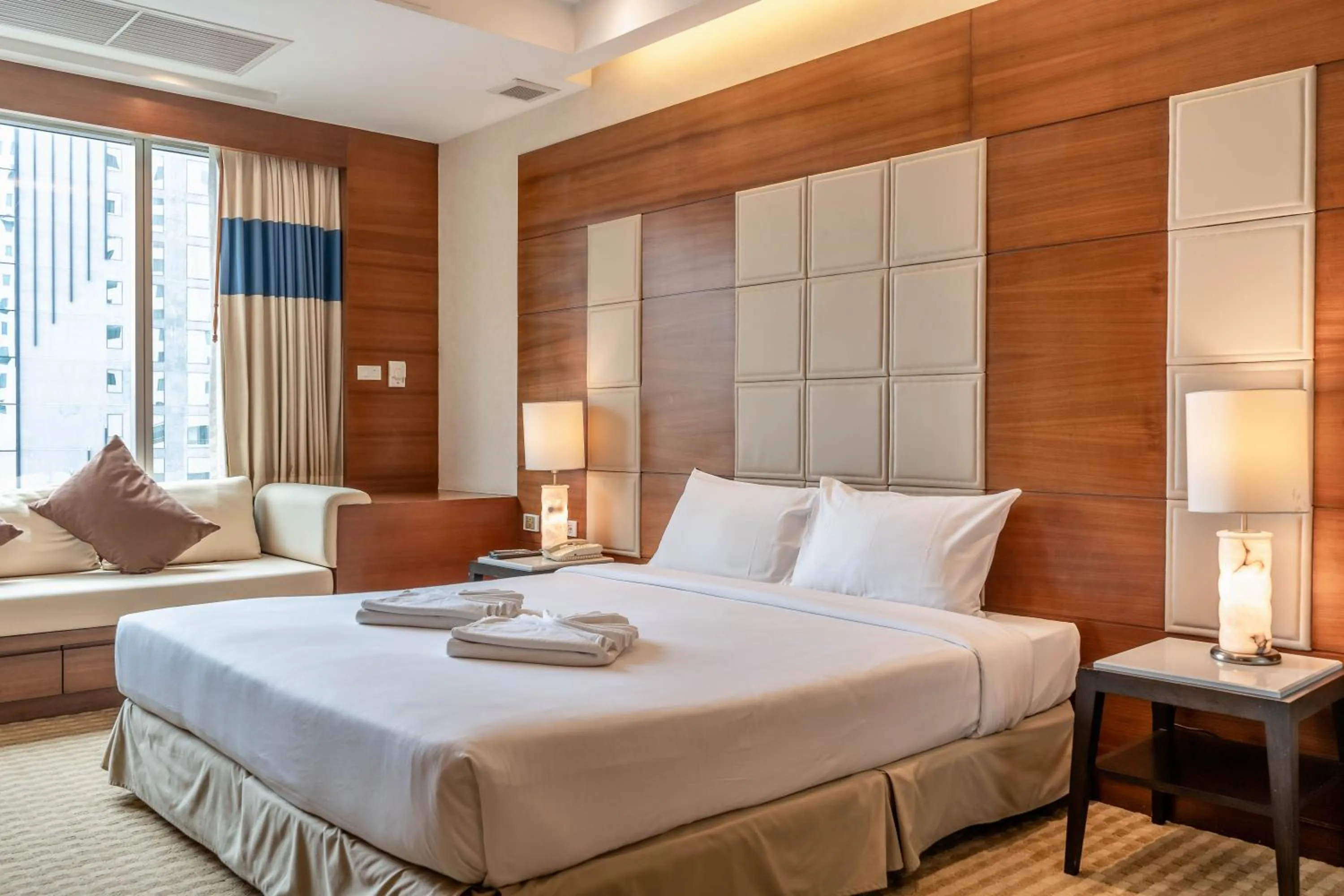 Bed in Jasmine City Hotel