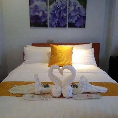 Bed in Royal Mansion Hotel