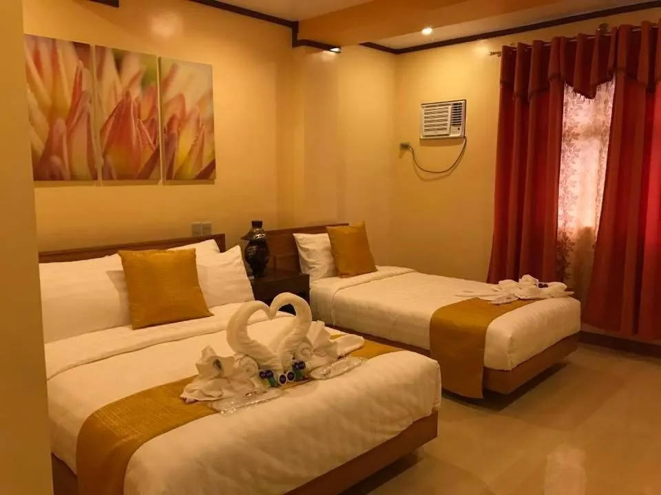 Bed in Royal Mansion Hotel