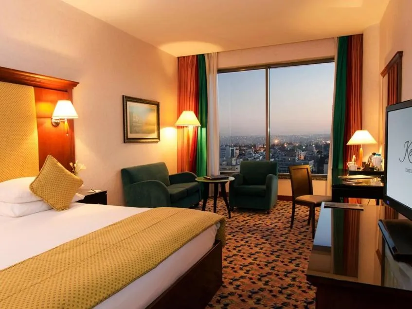 Bed in Royal Mansion Hotel