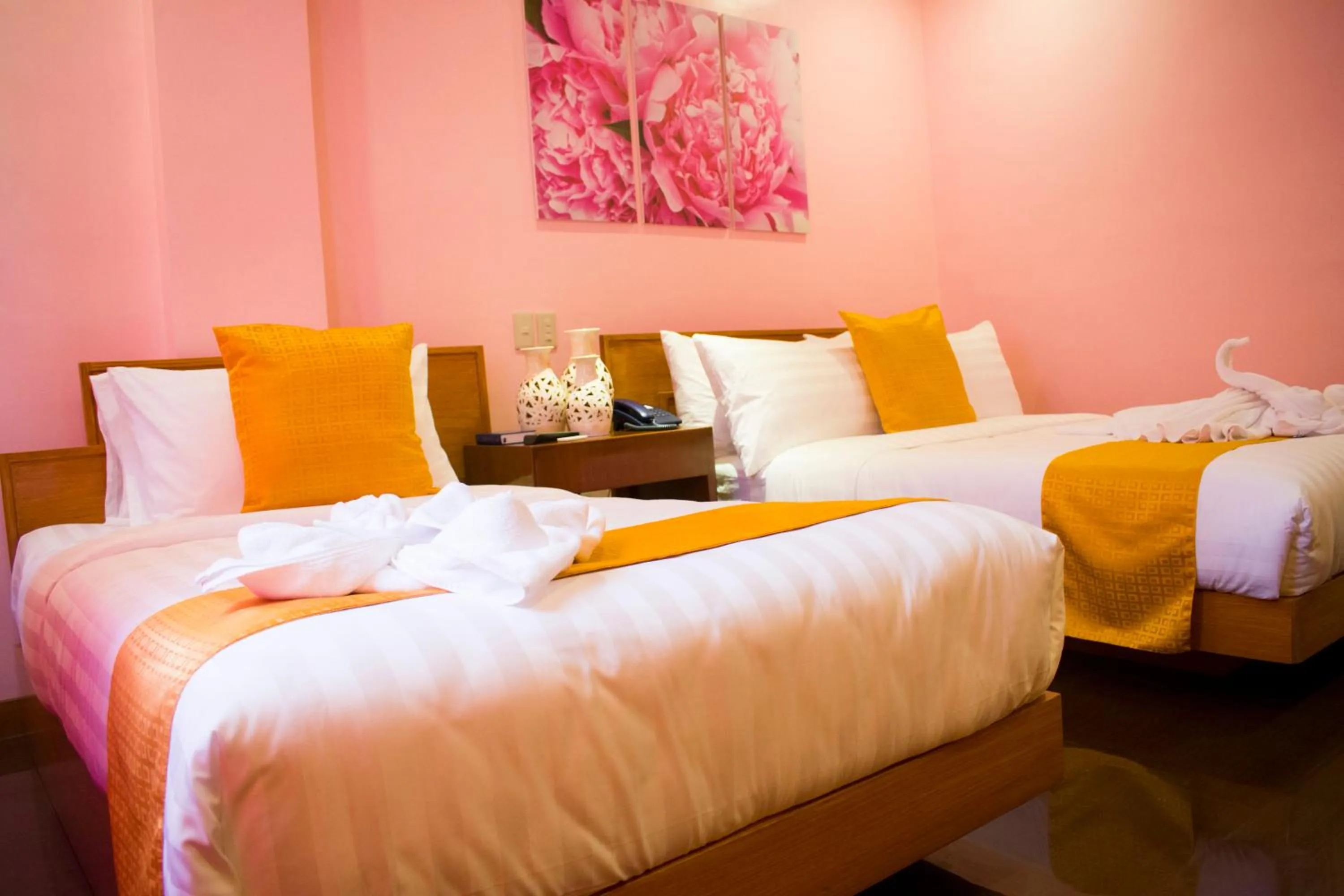 Bed in Royal Mansion Hotel