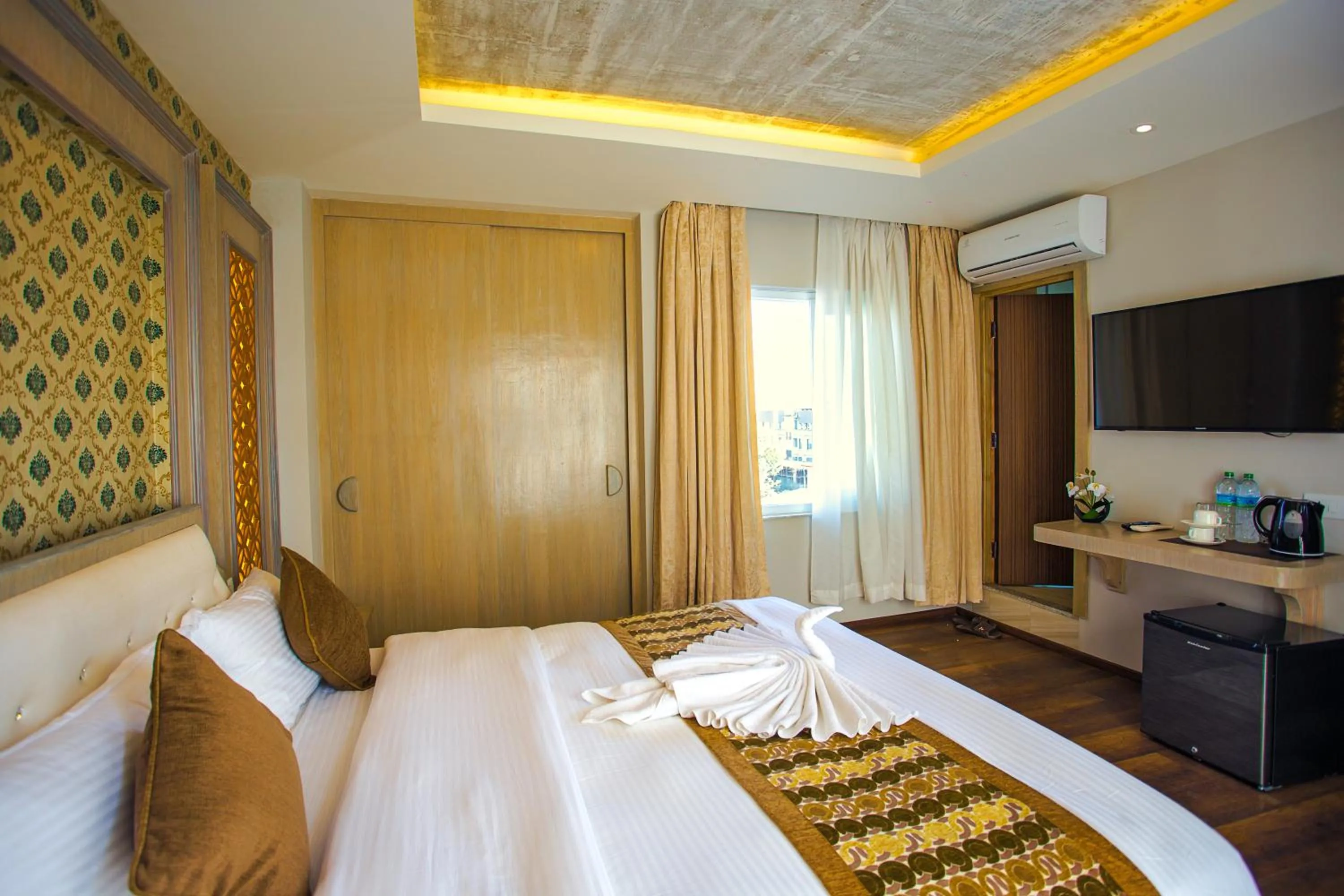 Communal lounge/ TV room, Bed in Bodhi Boutique Hotel