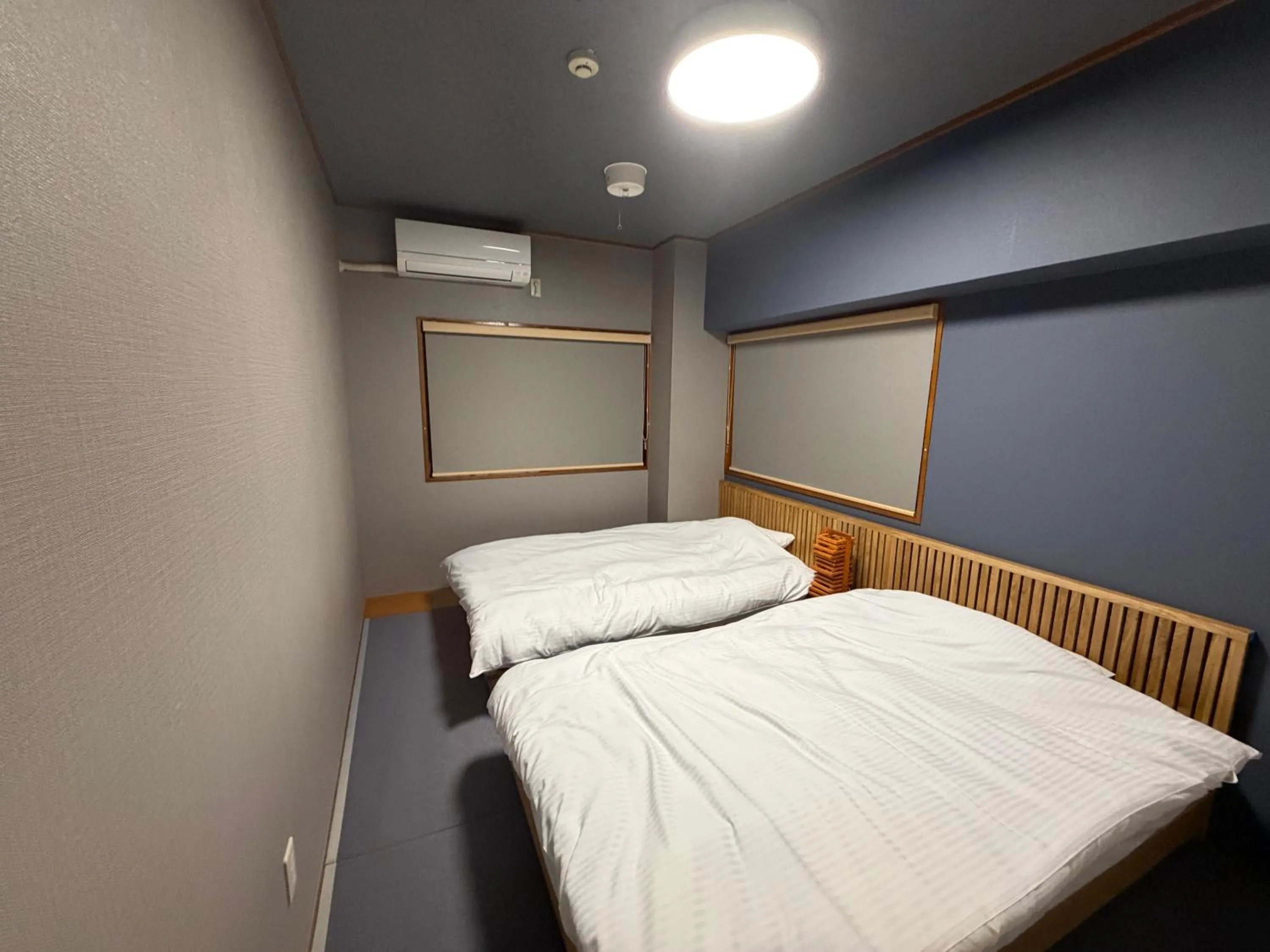 Bed in Kokusai Towns Inn