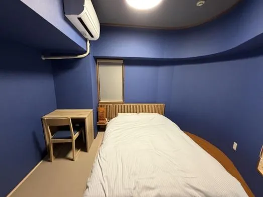 Bed in Kokusai Towns Inn