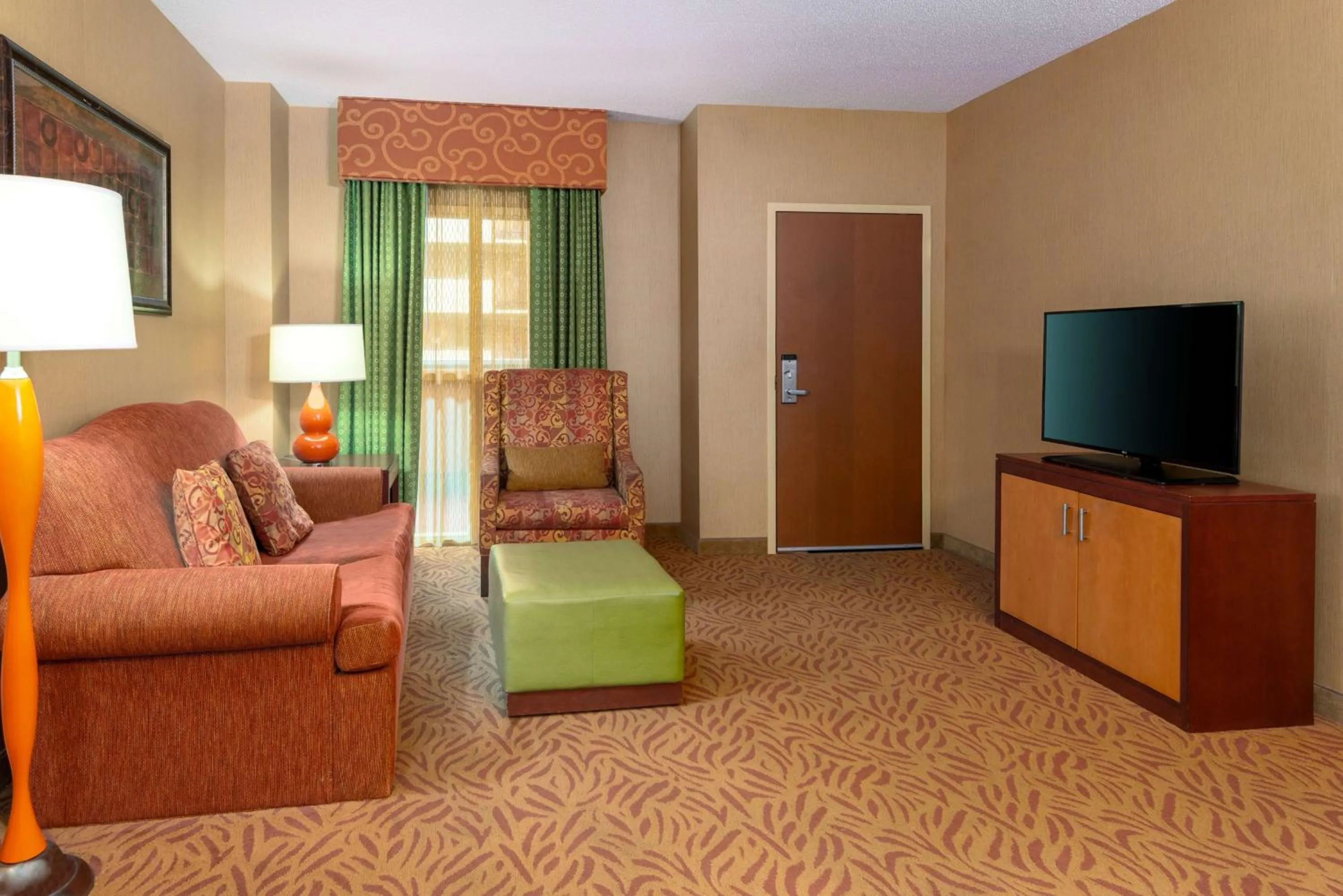 Bedroom in Embassy Suites Omaha- La Vista/ Hotel & Conference Center