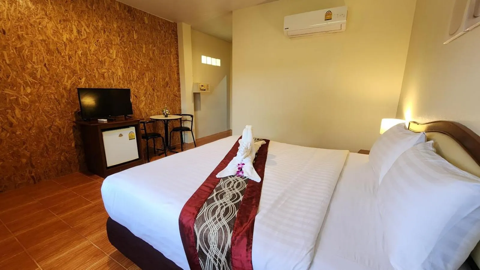 Bed in Mild Garden View Resort