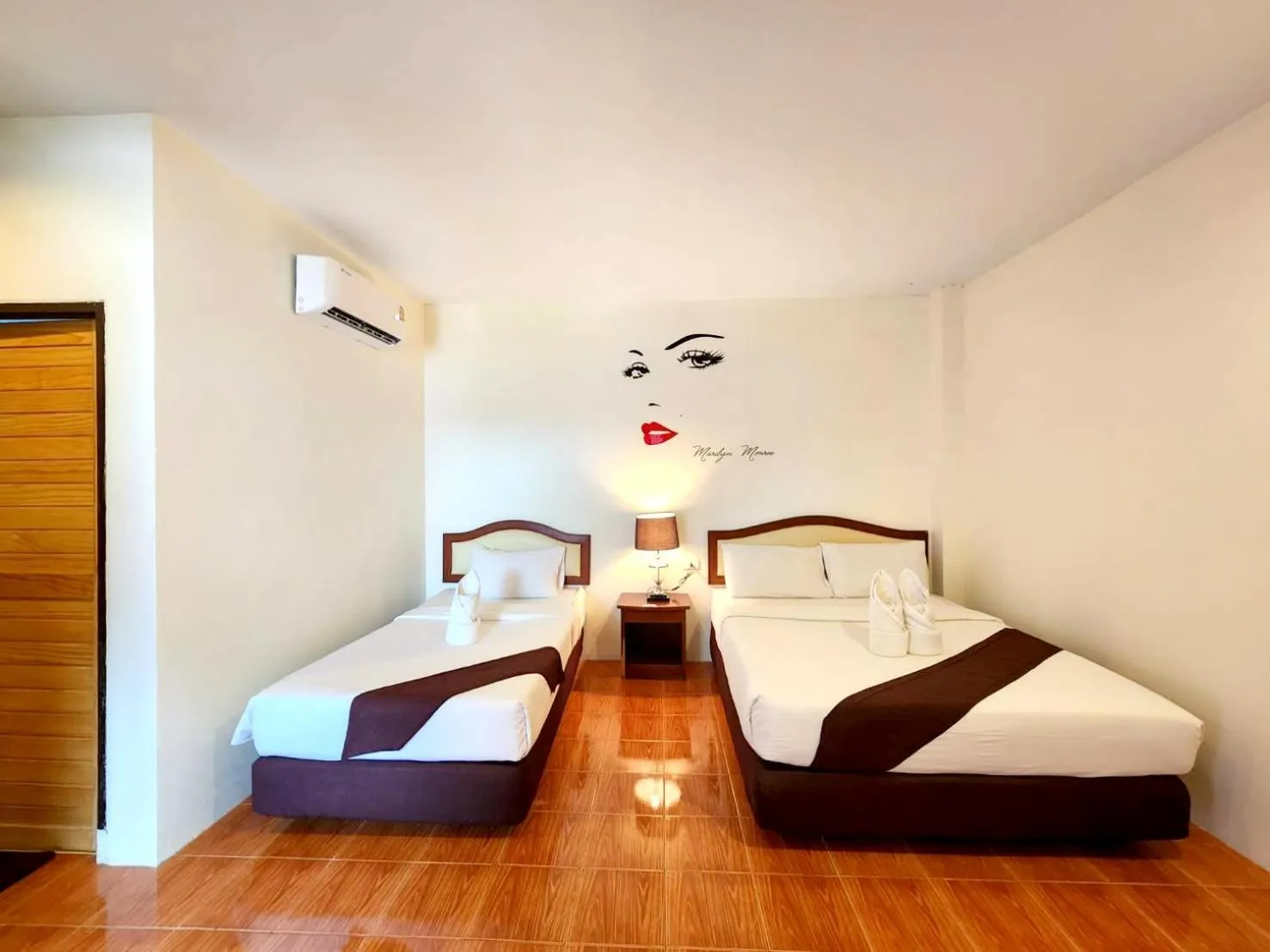 Bed in Mild Garden View Resort