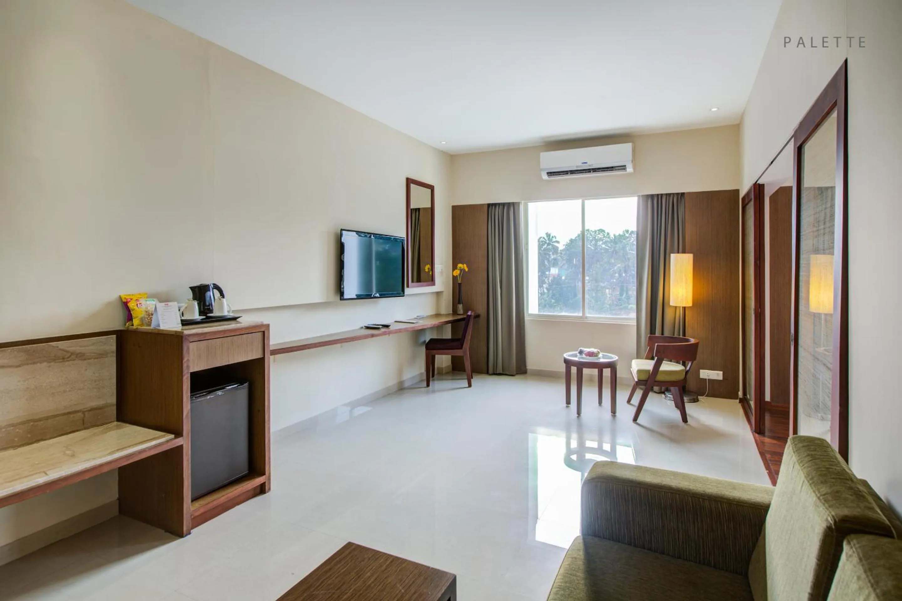 Living room, Bed in JK Residency Kelakam