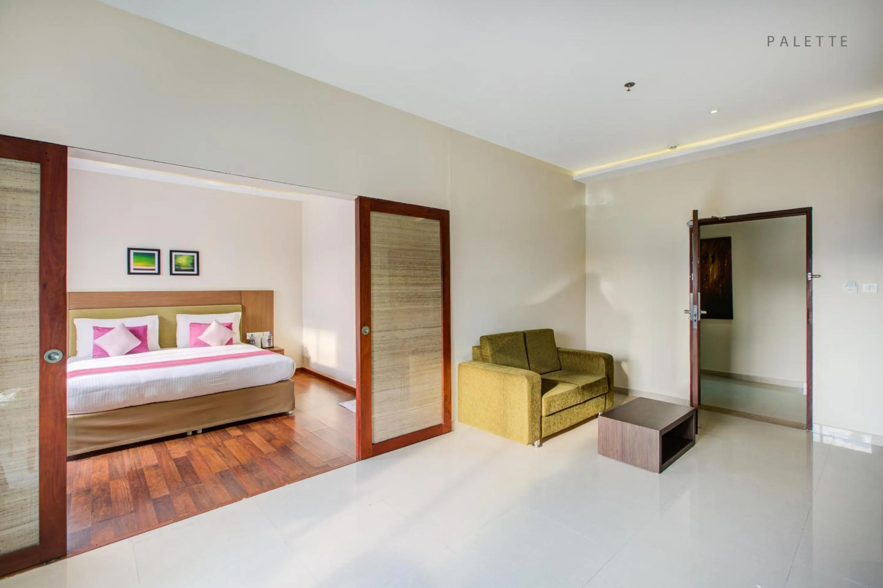 Seating area, Bed in JK Residency Kelakam