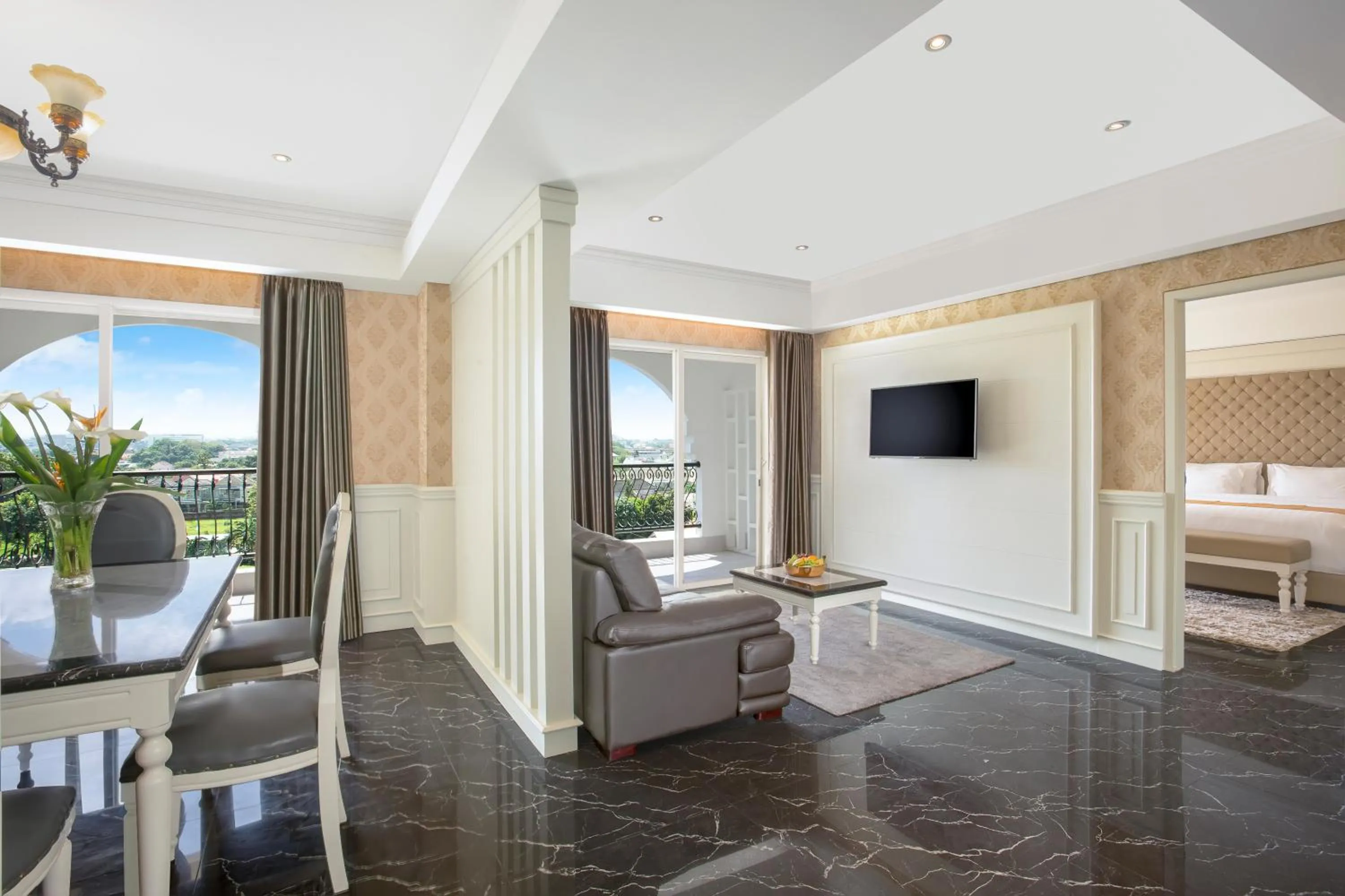 Communal lounge/ TV room, Bed in Grand Rohan Jogja